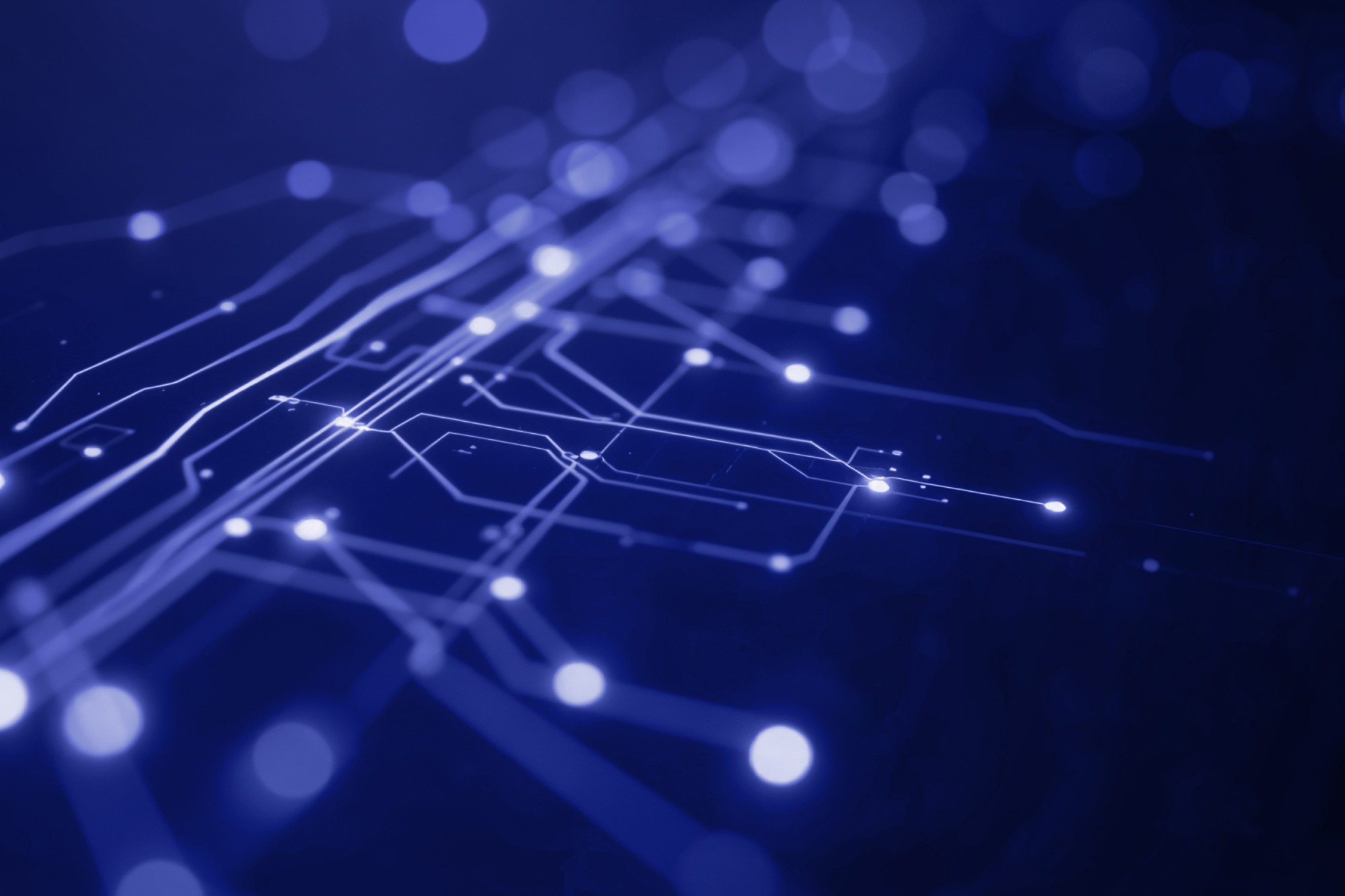Abstrakte blaue Grafik mit leuchtenden Linien und Knotenpunkten, die ein digitales Netzwerk und technologische Vernetzung symbolisieren.