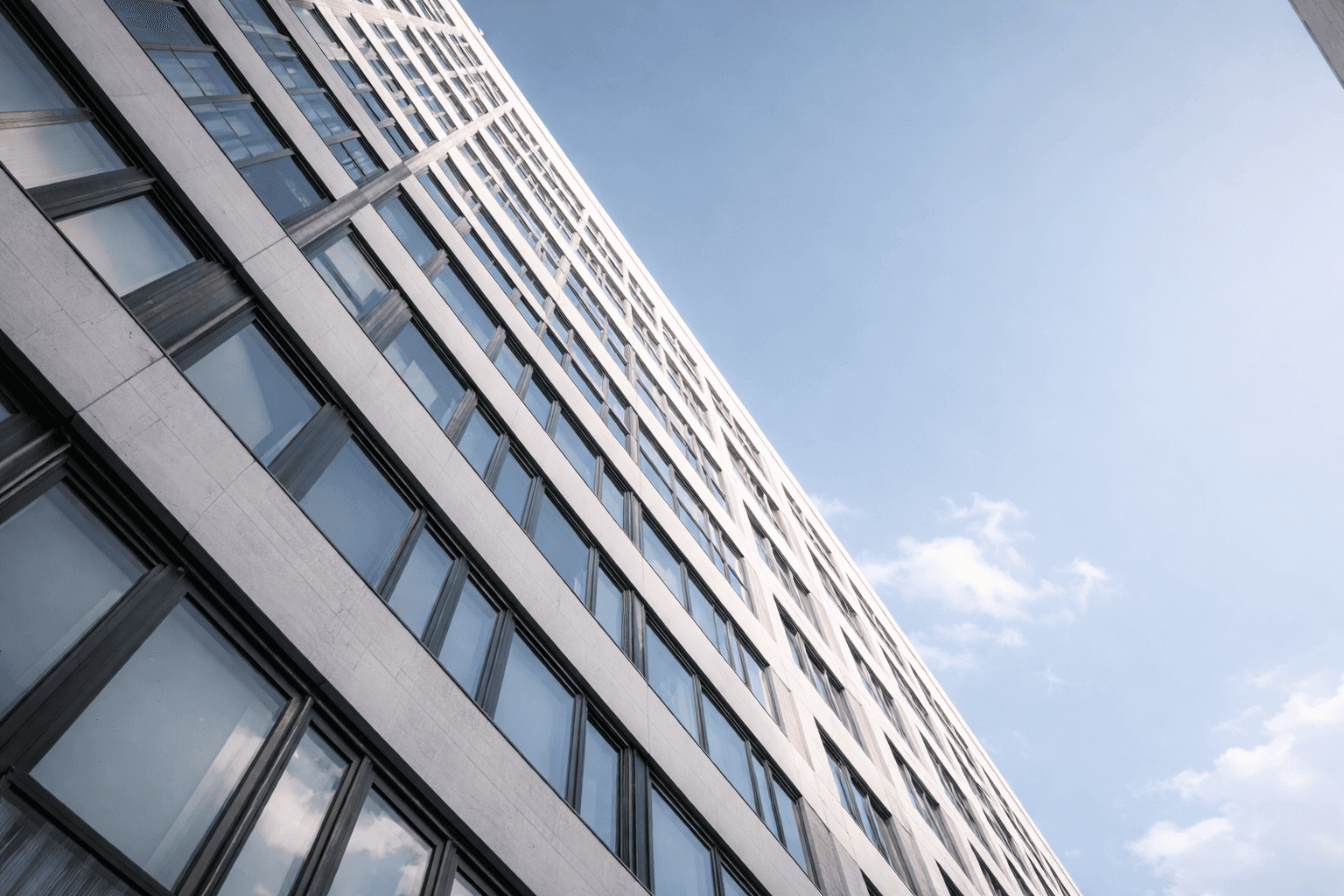 MUNiQ Group Project Office Cologne. Modern building facade, representing a key client hub and location for agile project management and consultation (by appointment).