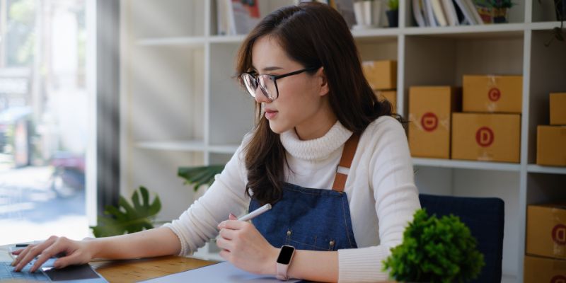 Small business owner researching about e-invoicing on a laptop