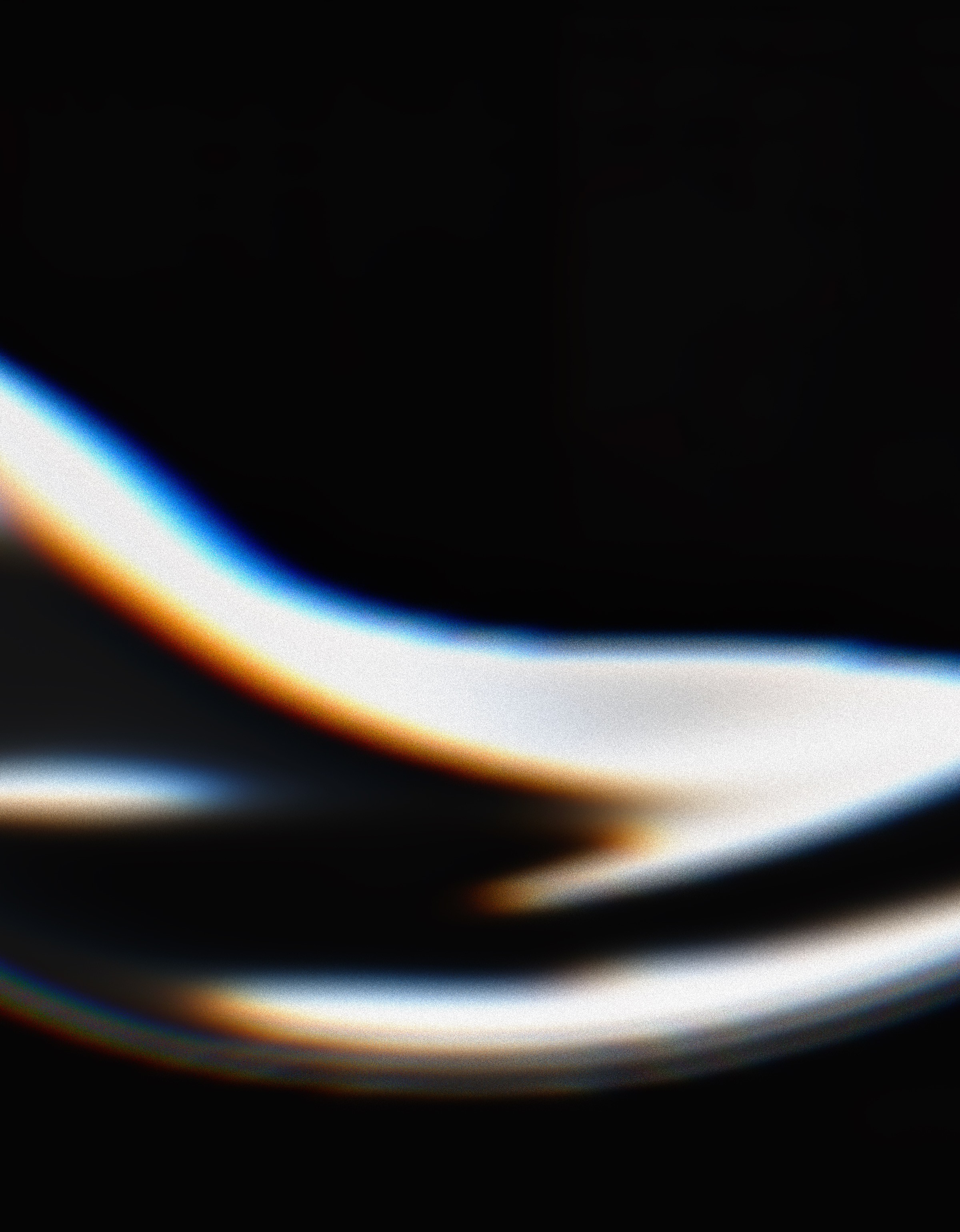 Abstract black and white image featuring smooth, flowing lines creating a sense of movement and depth.