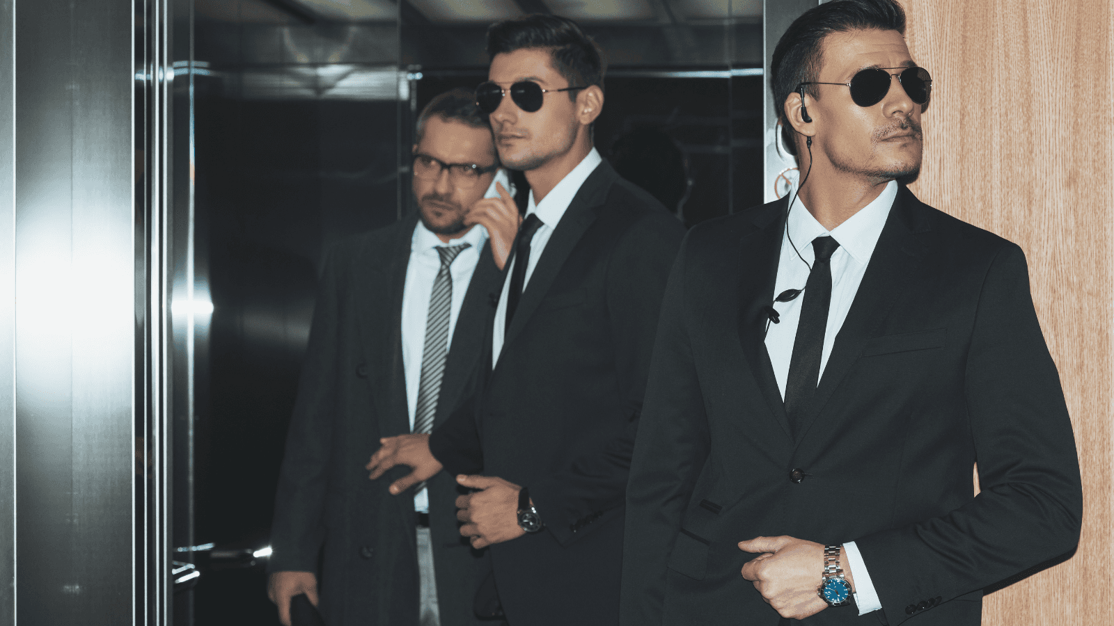 Security officers coming out of a lift