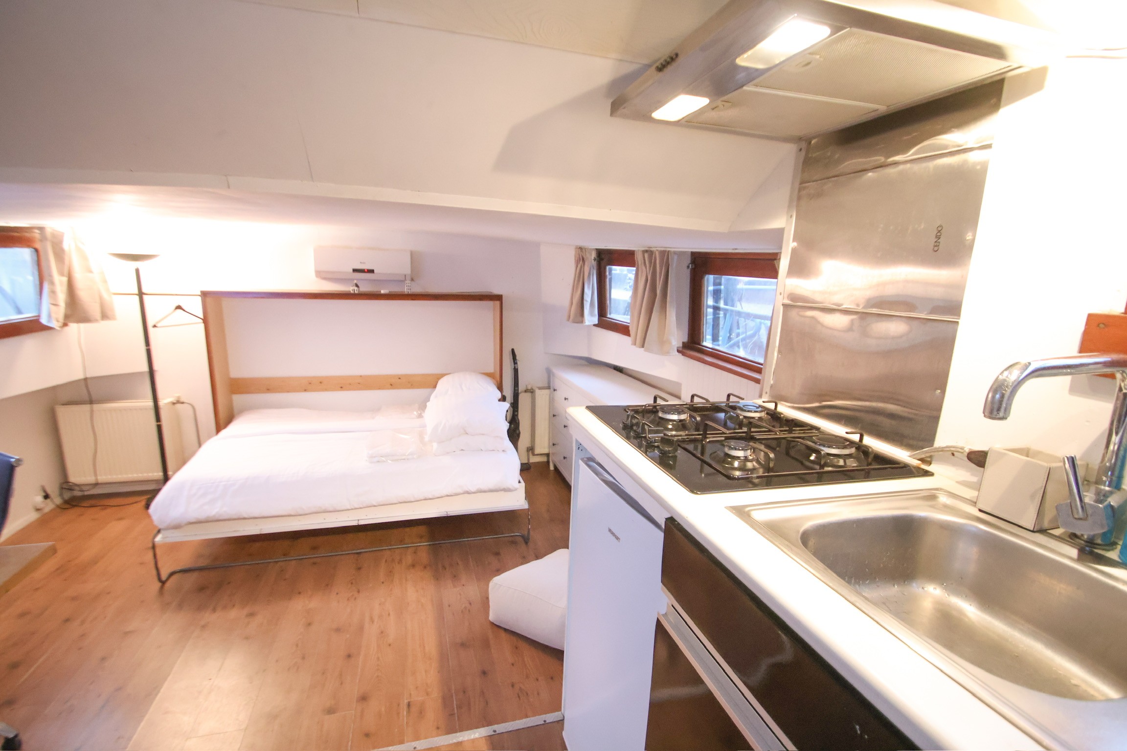 Classic bedroom with canopy bed and patterned pillows