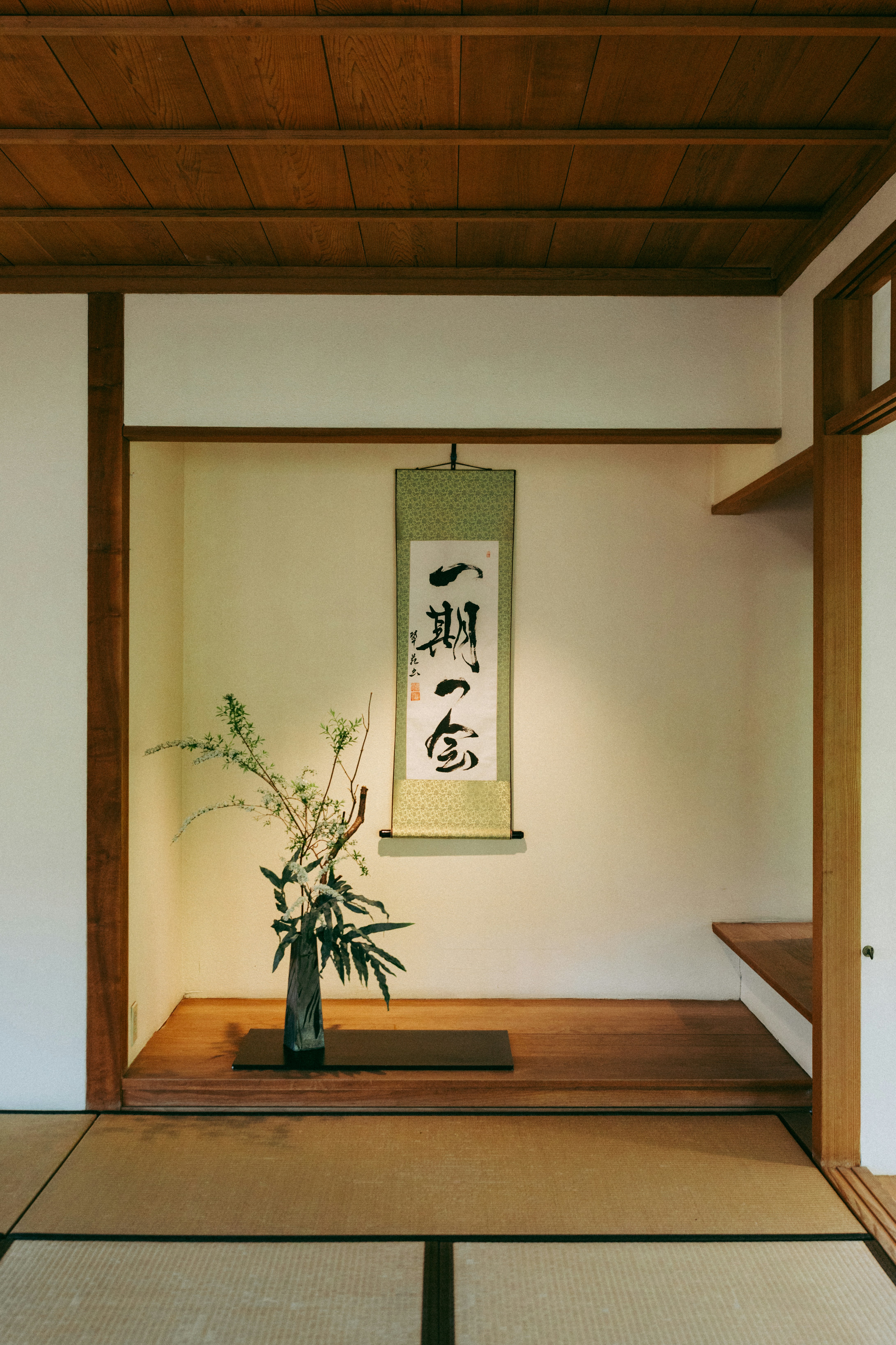 Japanese tokonoma alcove with scroll and ikebana