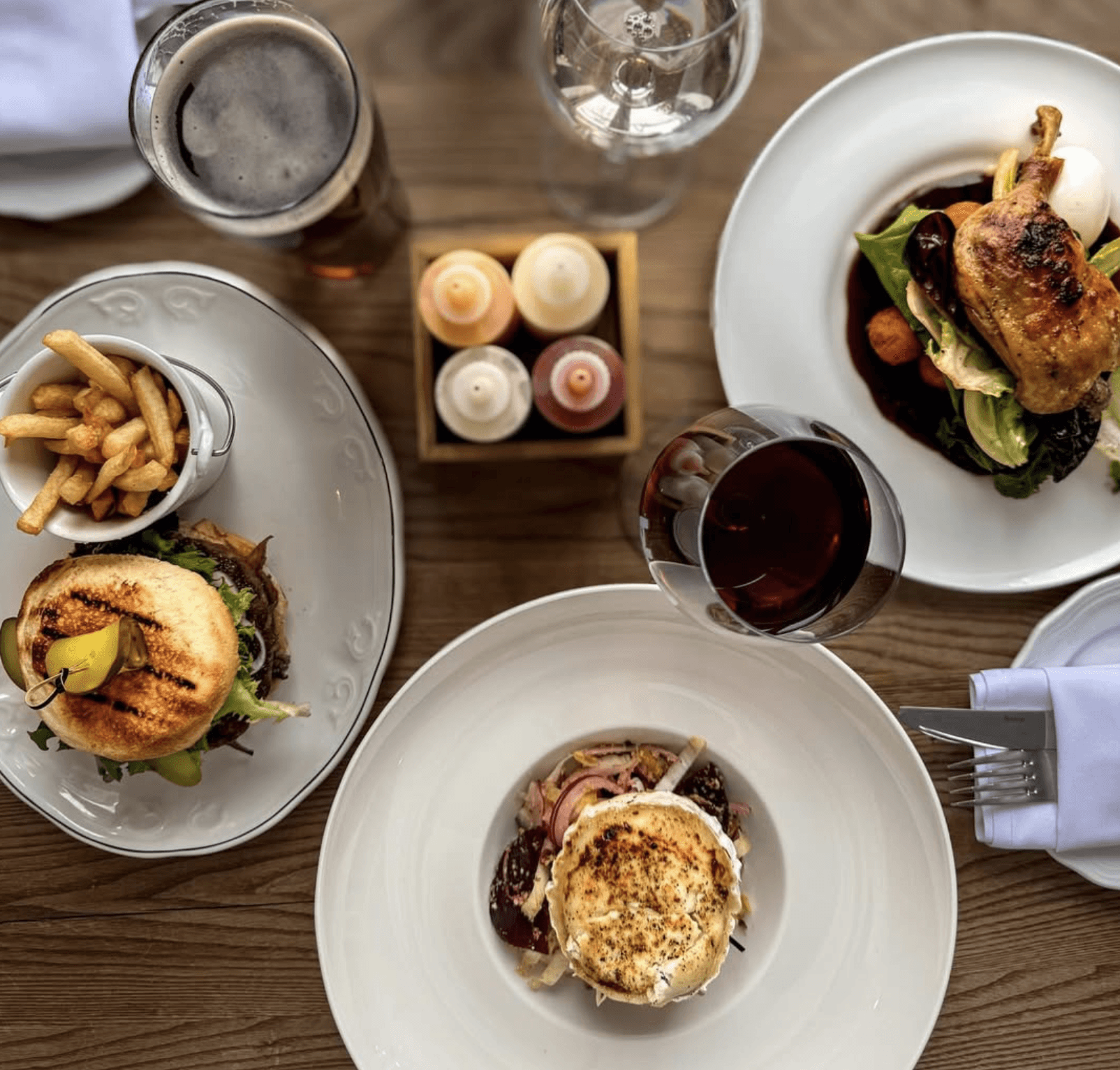 Elegant private dining area with long wooden table and warm lighting.