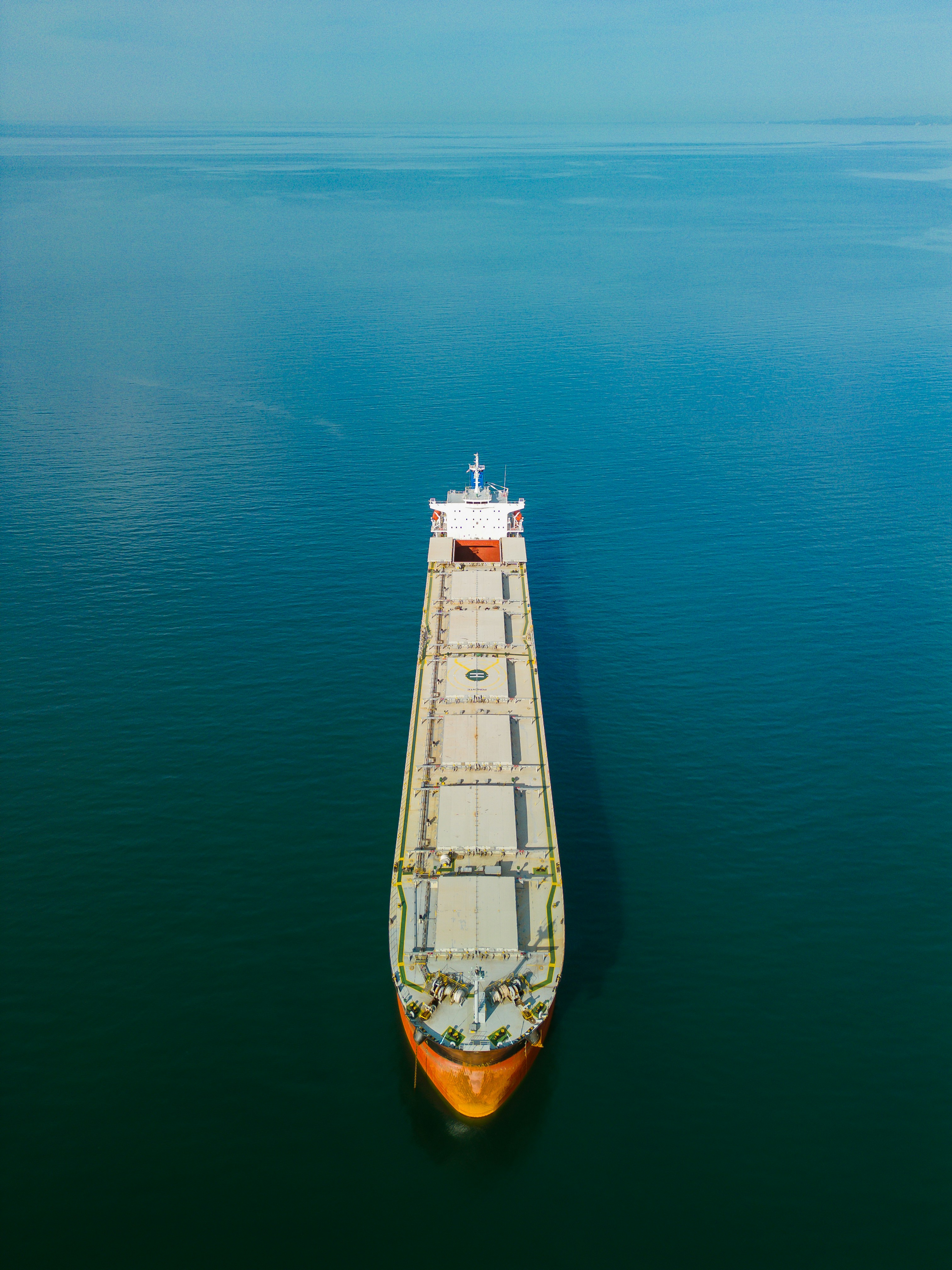black and brown ships under cloudy sky