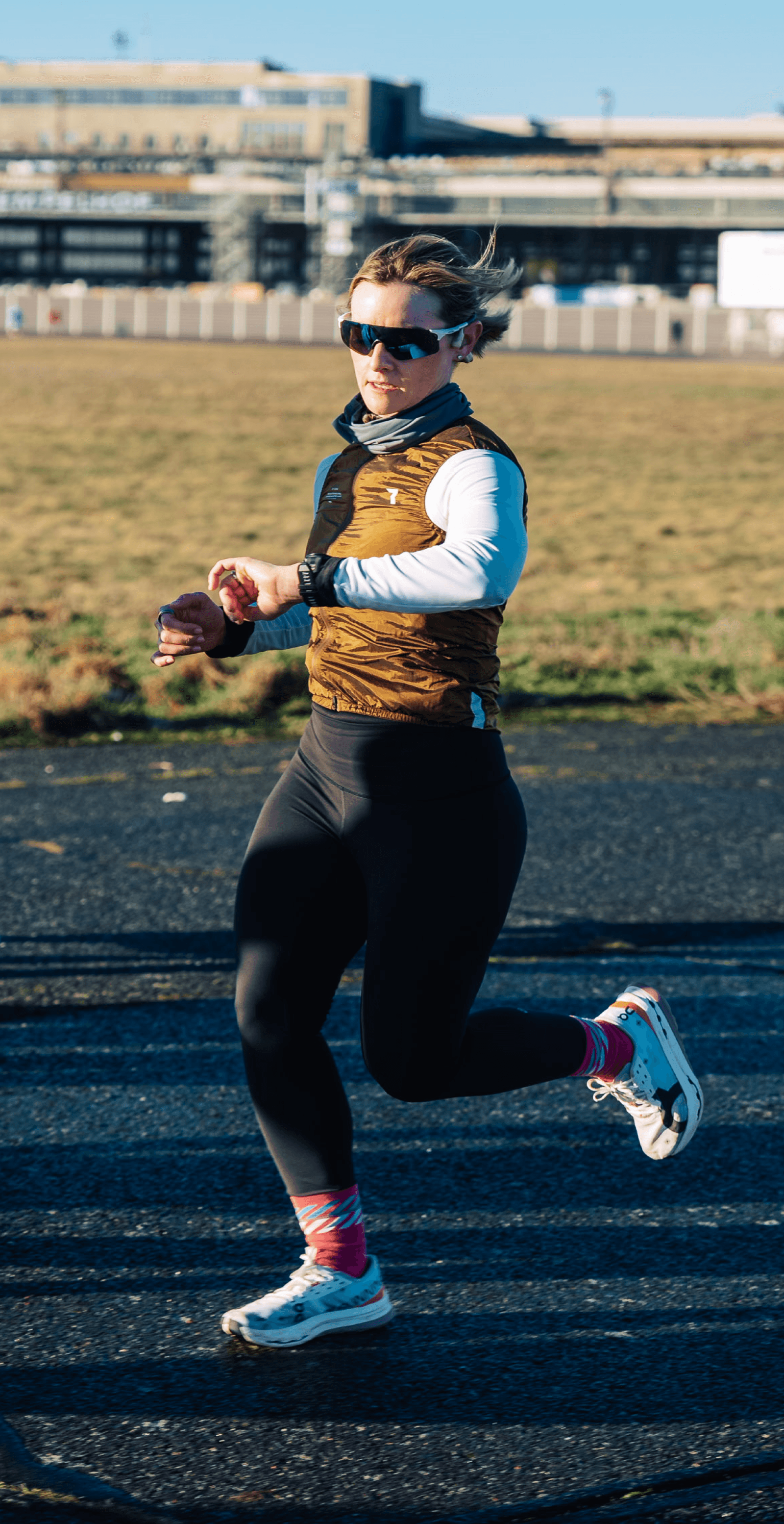 Runner checking the time on the Pacre Race