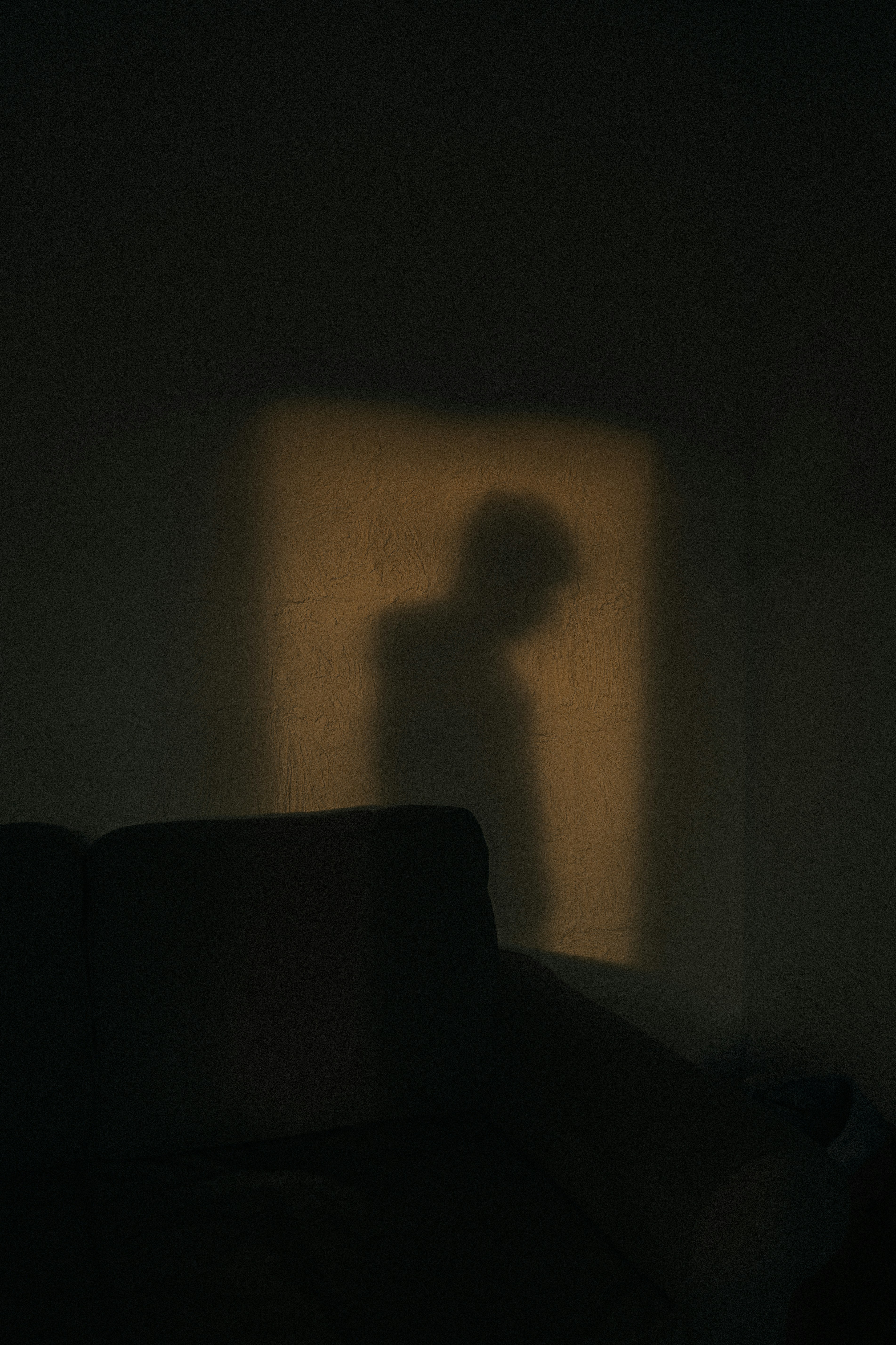 black sofa chair near white wall