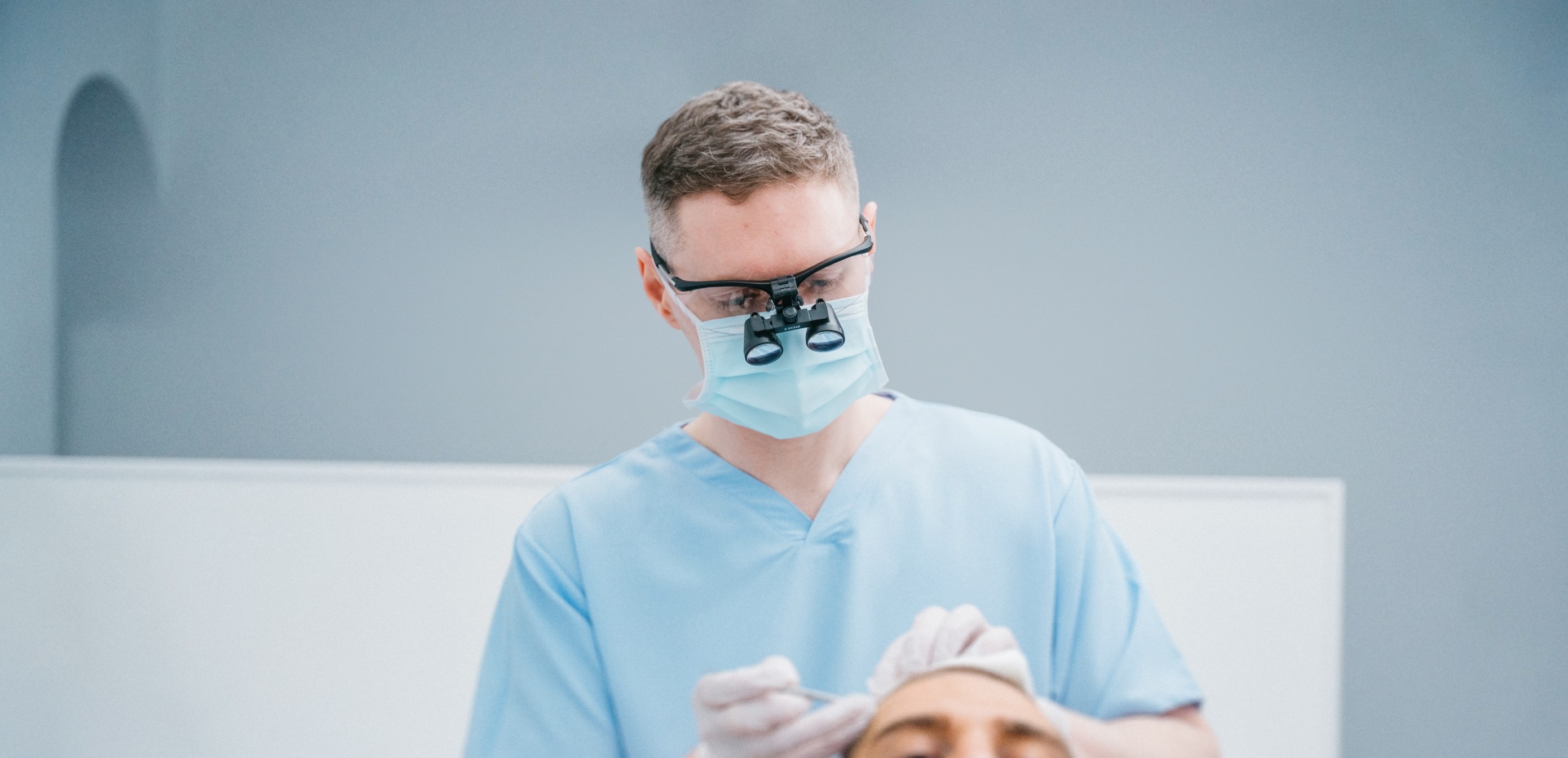 Dr Clarke Performing Hair Transplant Surgery
