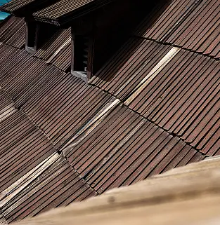 Aged roof section before replacement