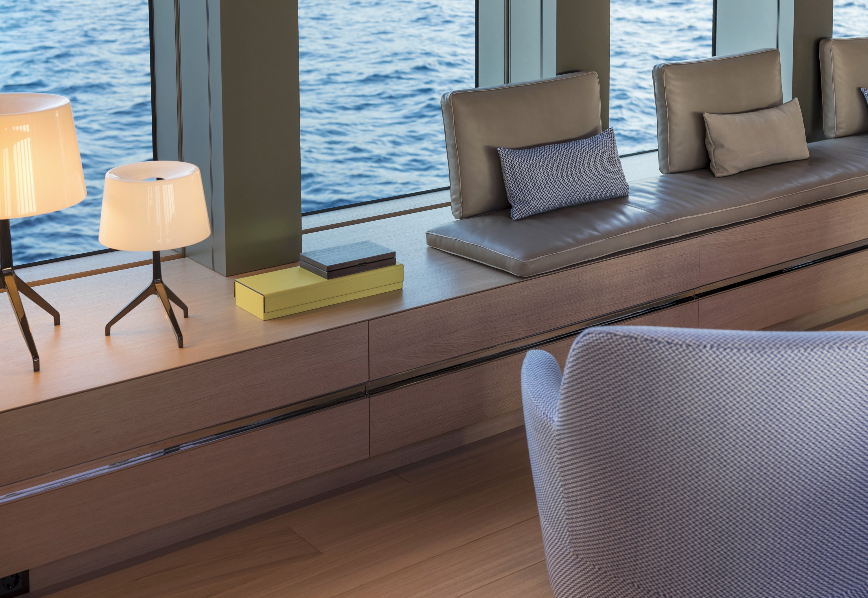 yellow flowers in brown woven basket on blue table
