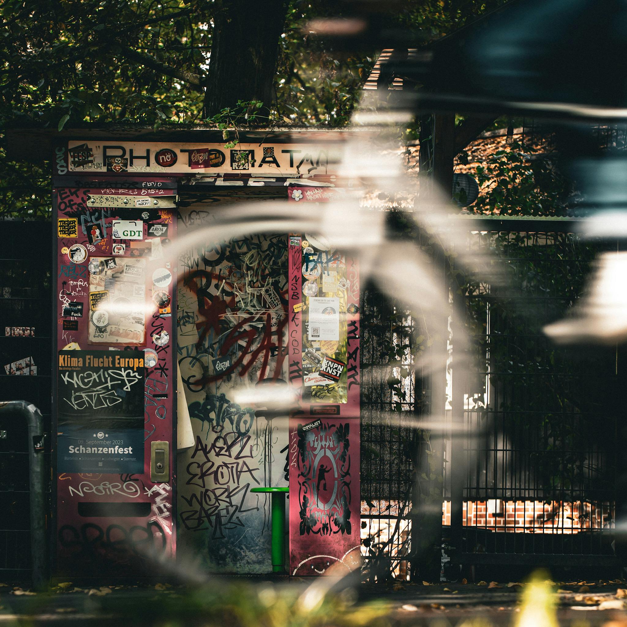 Woman in a light suit sitting thoughtfully against a terracotta wall