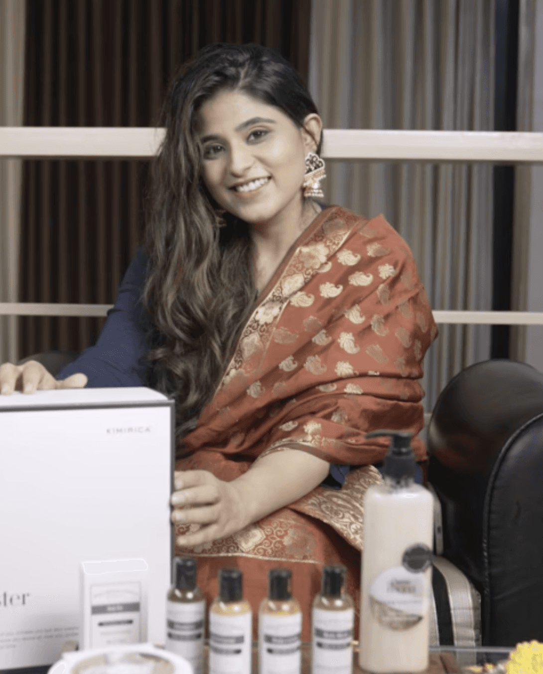 a person sitting on a couch with a laptop