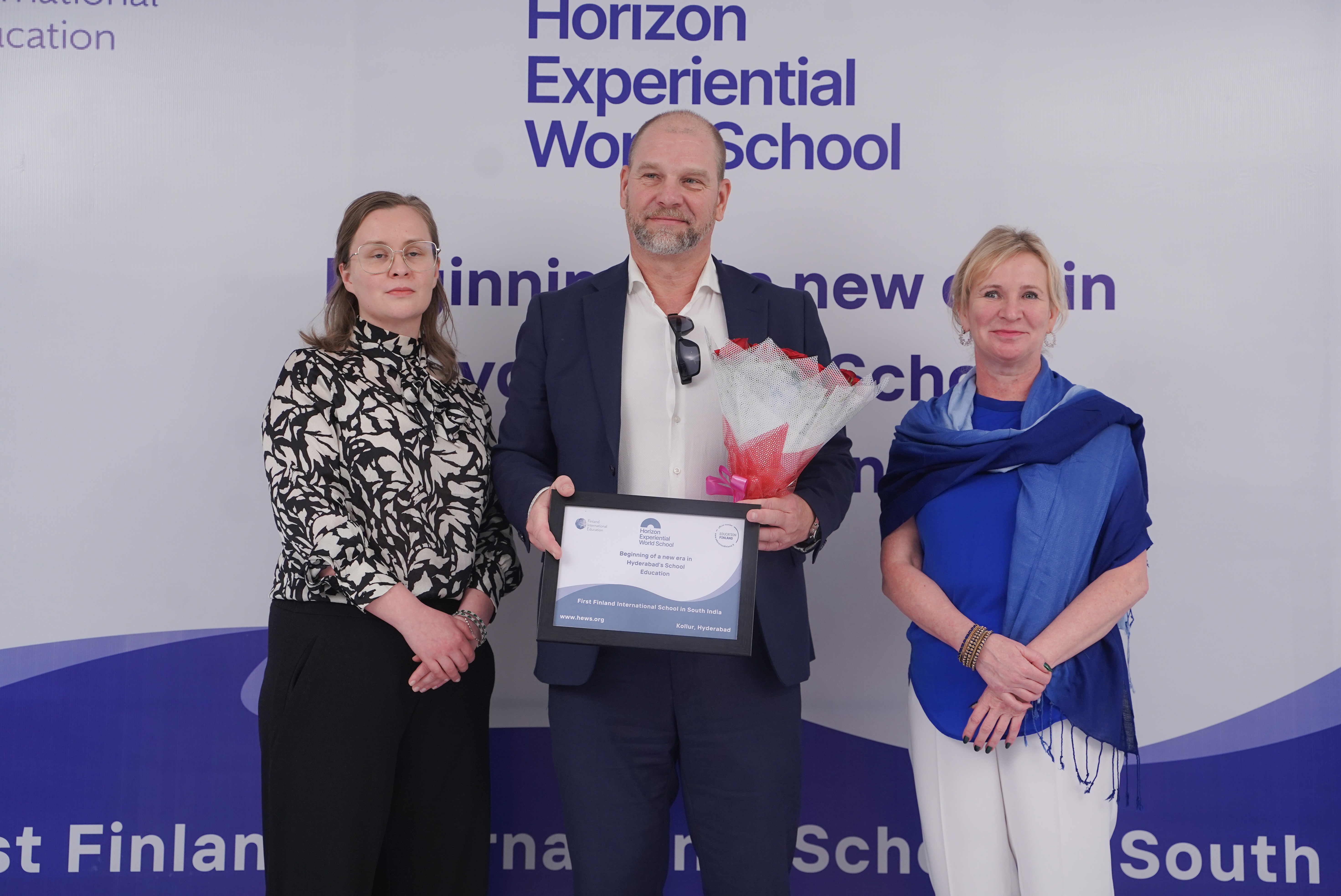 A school building stands against the backdrop of a clear sky