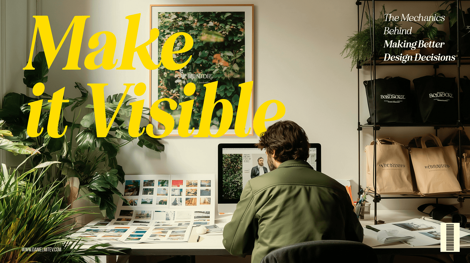 A designer sits at a desk filled with printed visuals and works on a dual-monitor setup, reviewing visual layouts. Bold yellow text reads “Make it Visible,” highlighting the importance of clarity in design communication. The space is filled with greenery, branded tote bags, and product packaging, reflecting a creative and organized work environment.