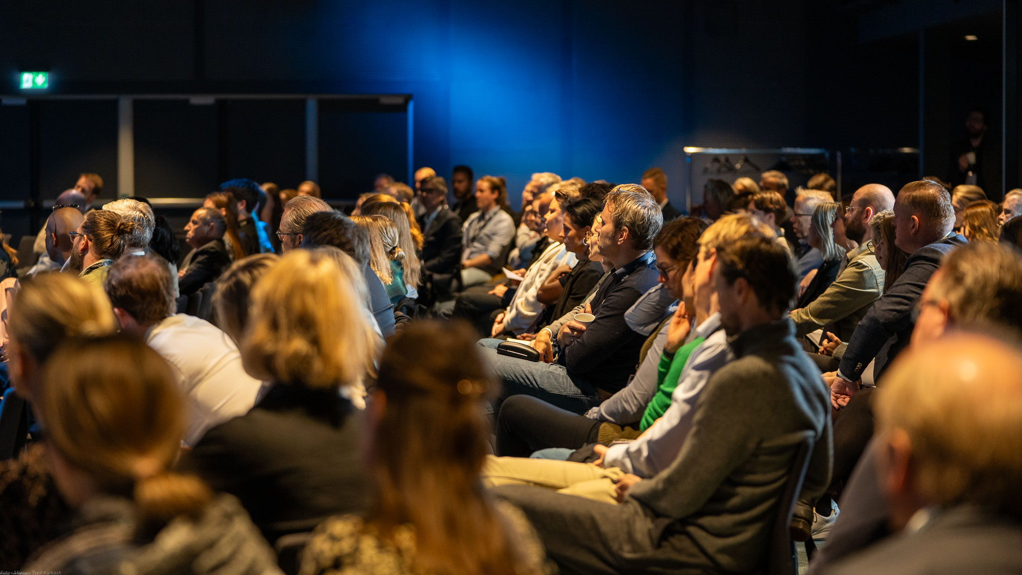 Man smiling while working on his computer