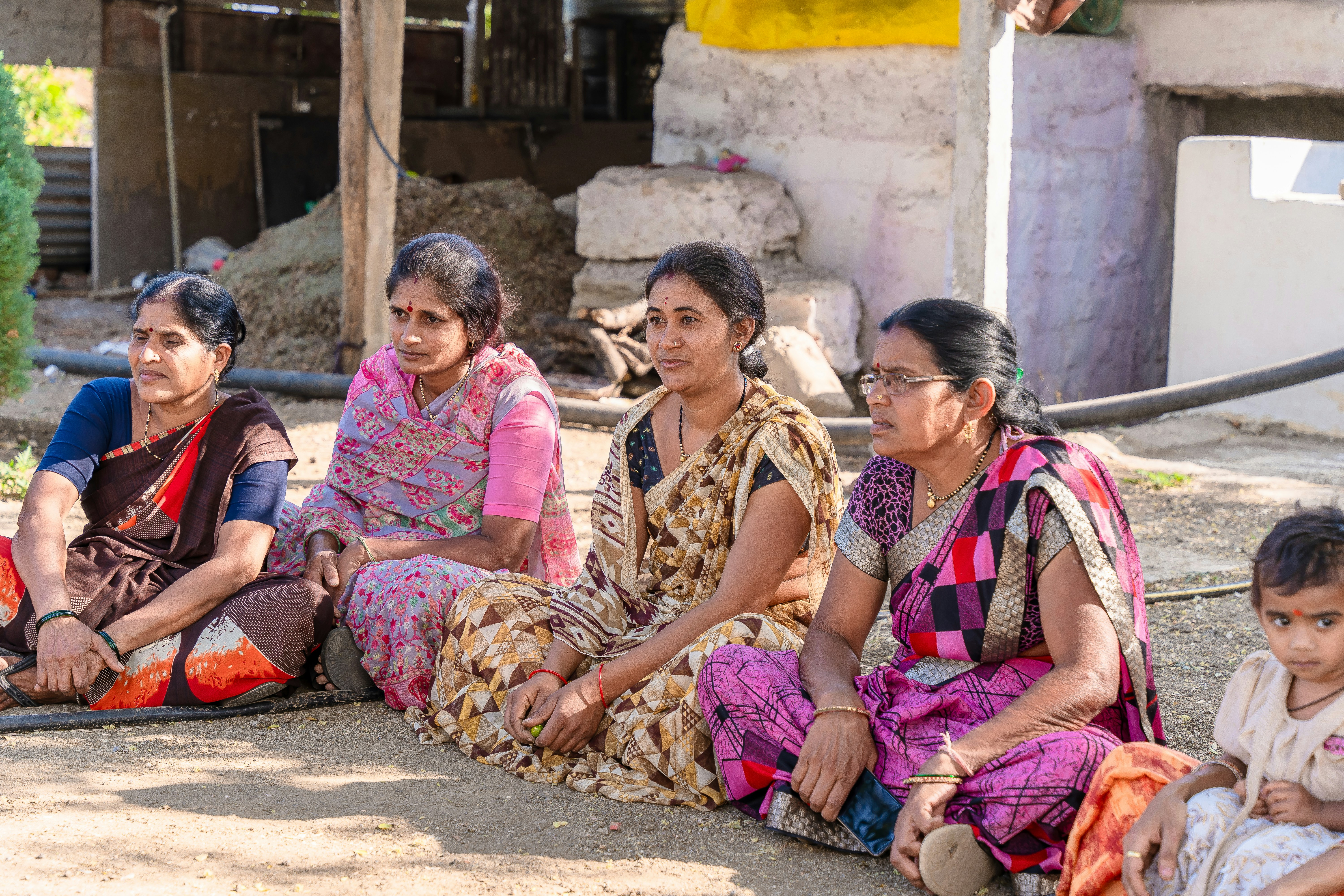 a group of women sitting next to each other