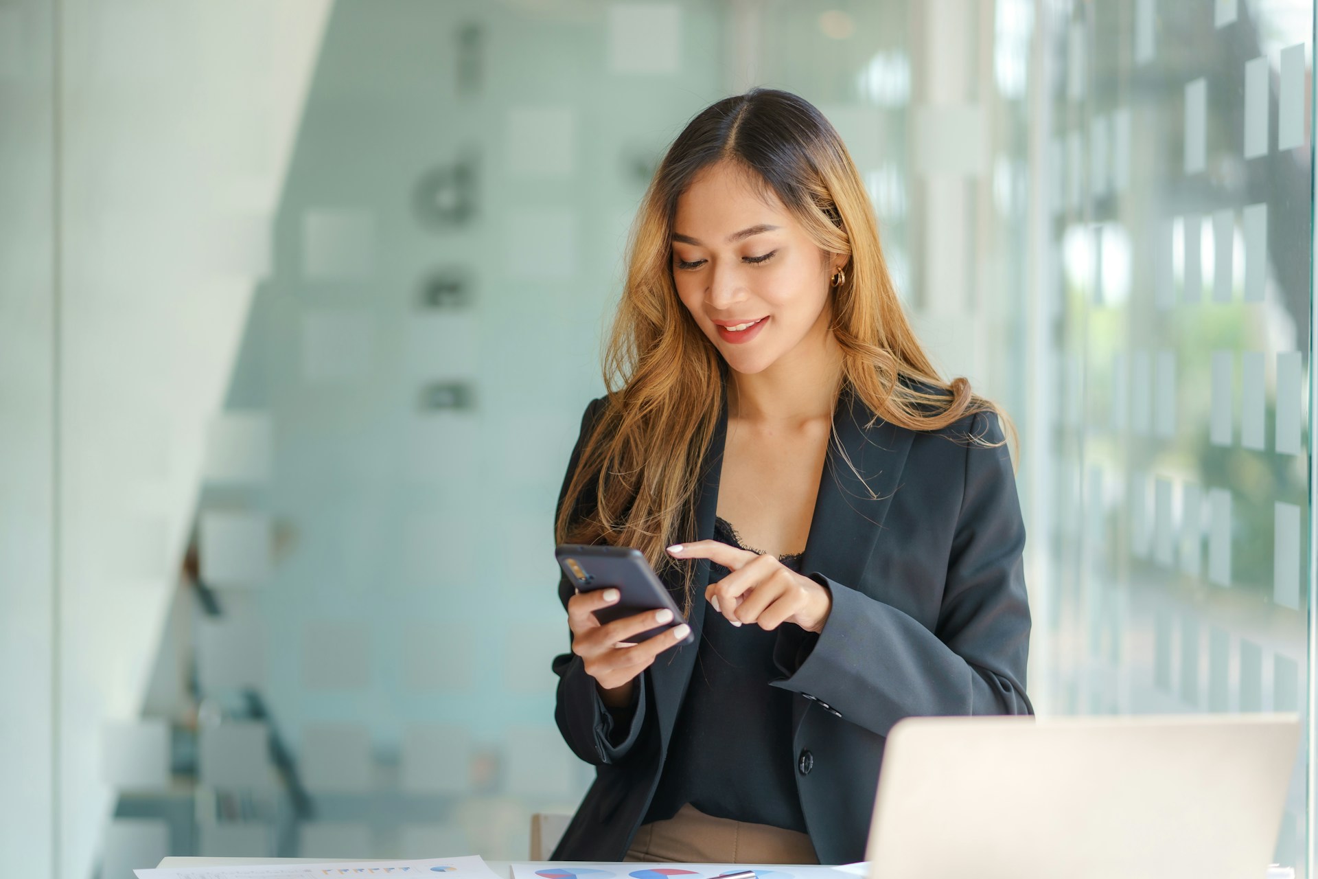 A woman holding a phone