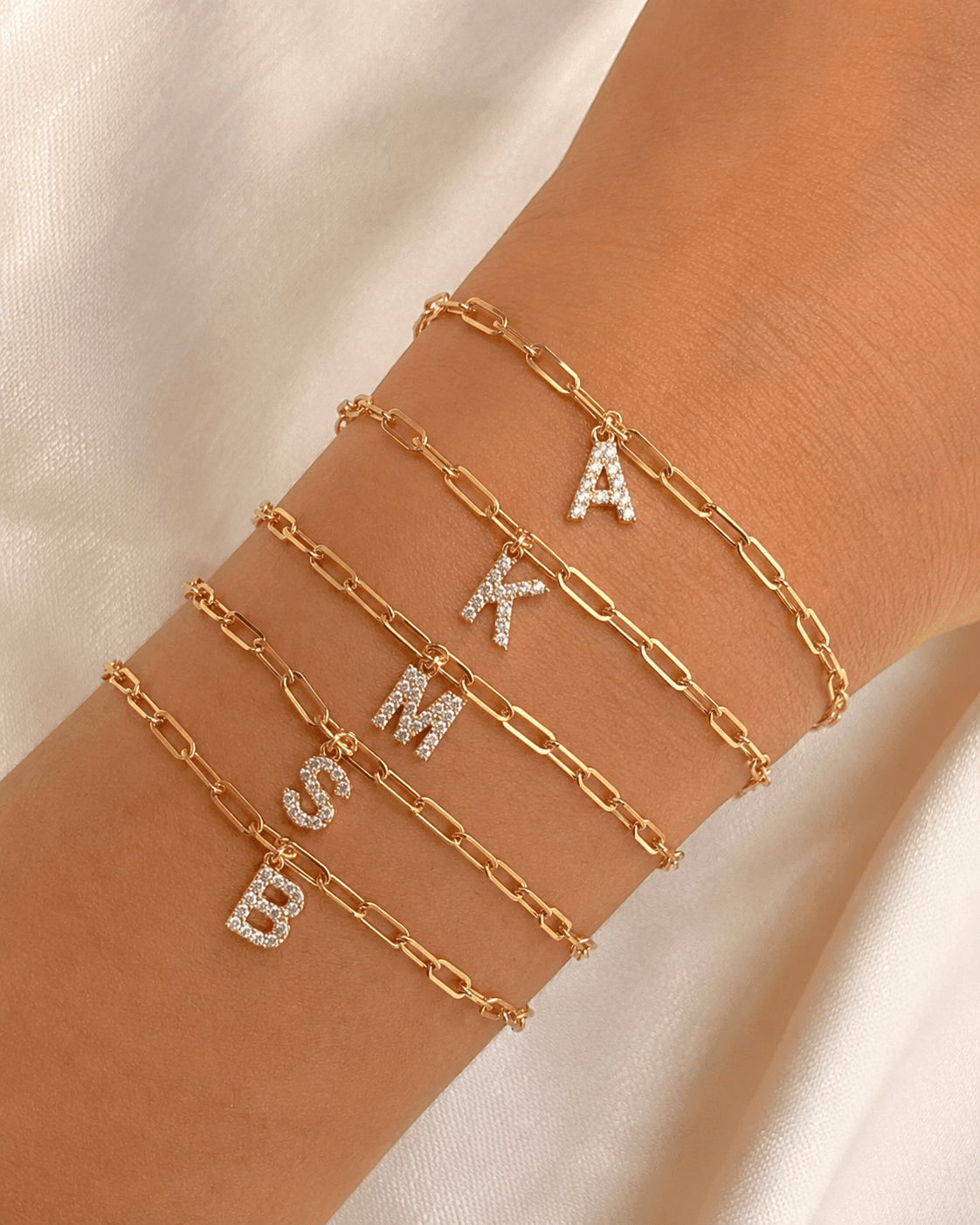 Letter charm bracelets welded on