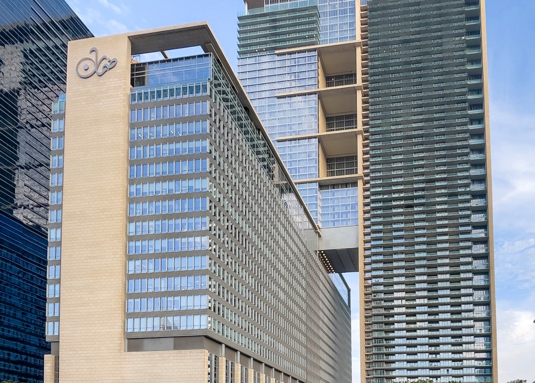 Modern facade of Burj Daman, a prime location for corporate office leasing and real estate growth.