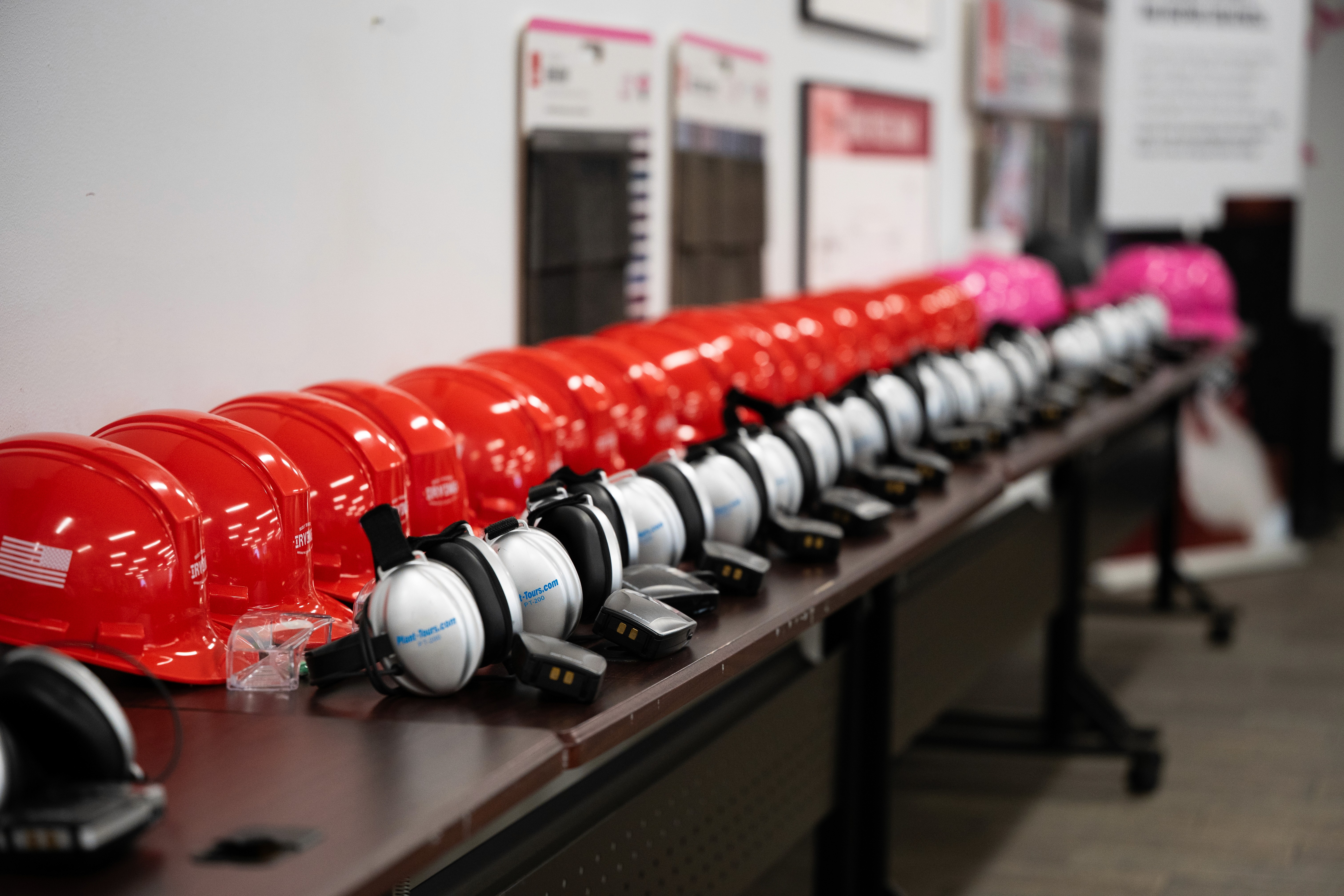 a line of hard hats photographed to showcase the preparation of Irving manufacturing week.