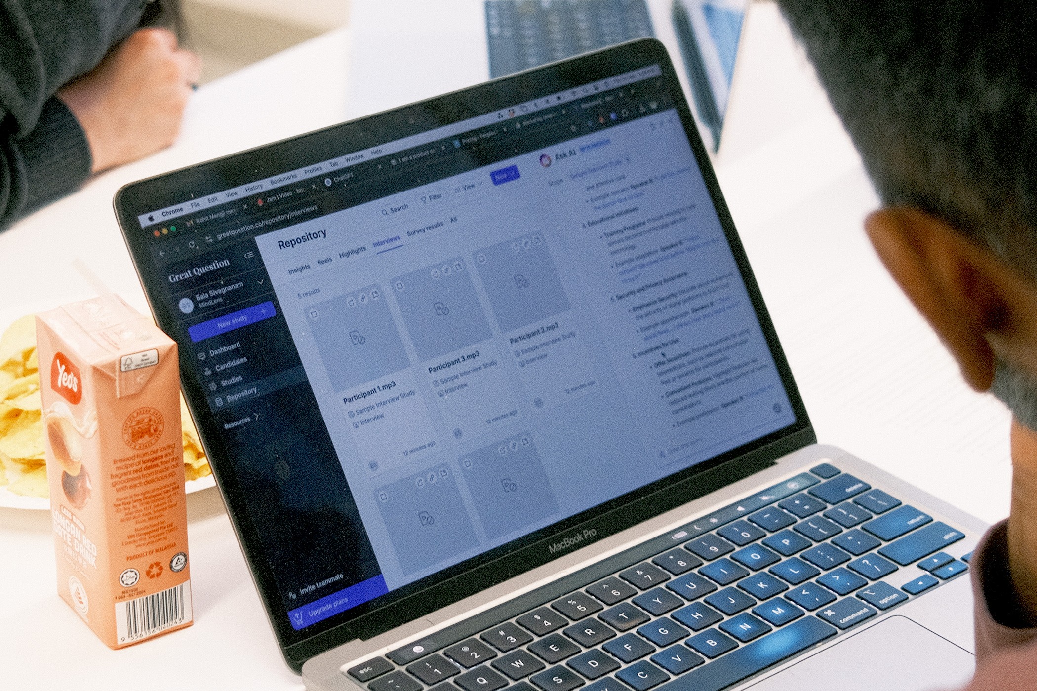 A zoom-in close up shot of a participant's Macbook featuring AI tool, Great Question.