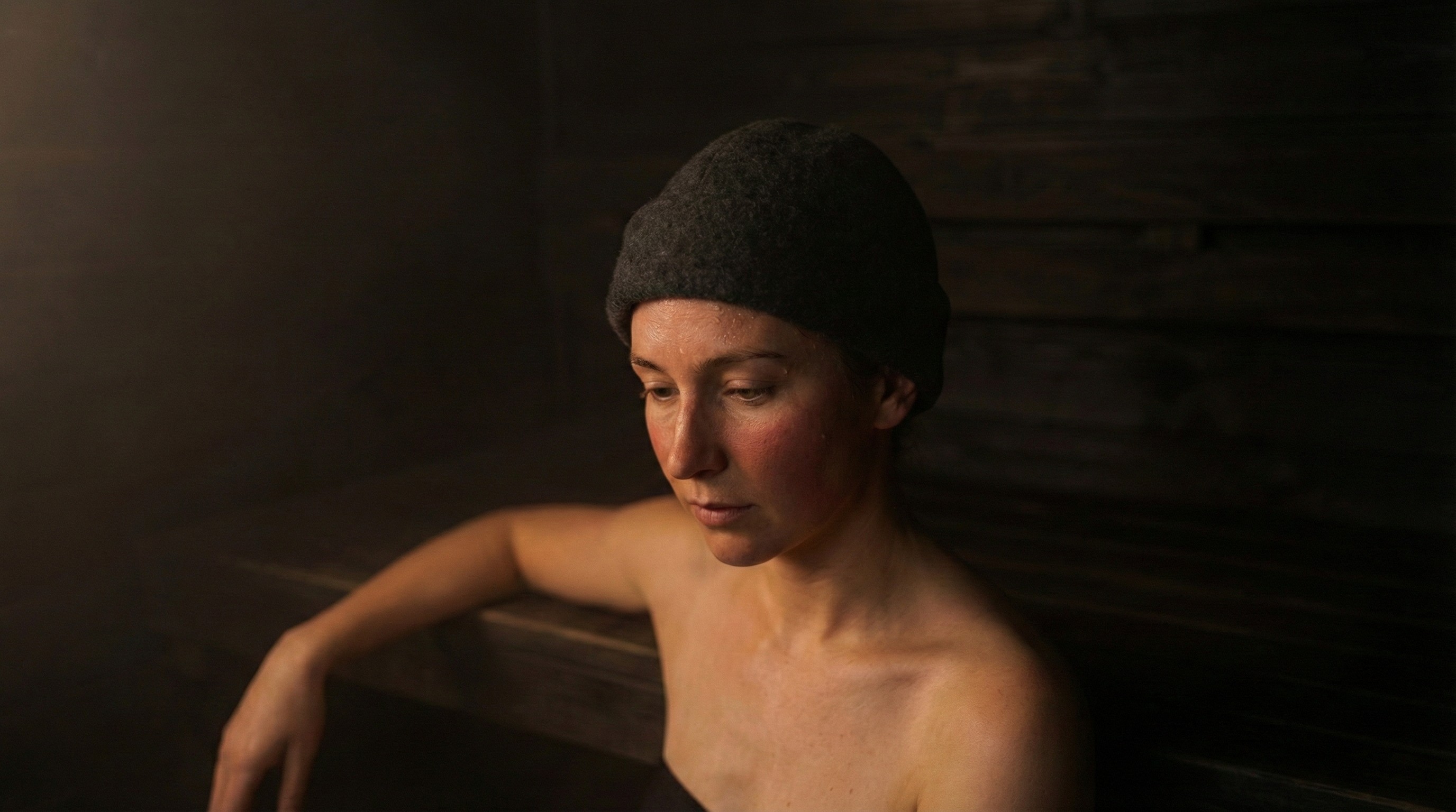 a man wearing headphone sitting on a cube chair