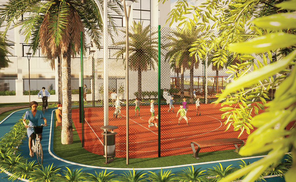 A park featuring a tennis court, with the iconic Cloud Tower of Dubai rising in the background against a sunny sky.