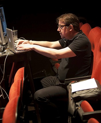a man is working on a laptop