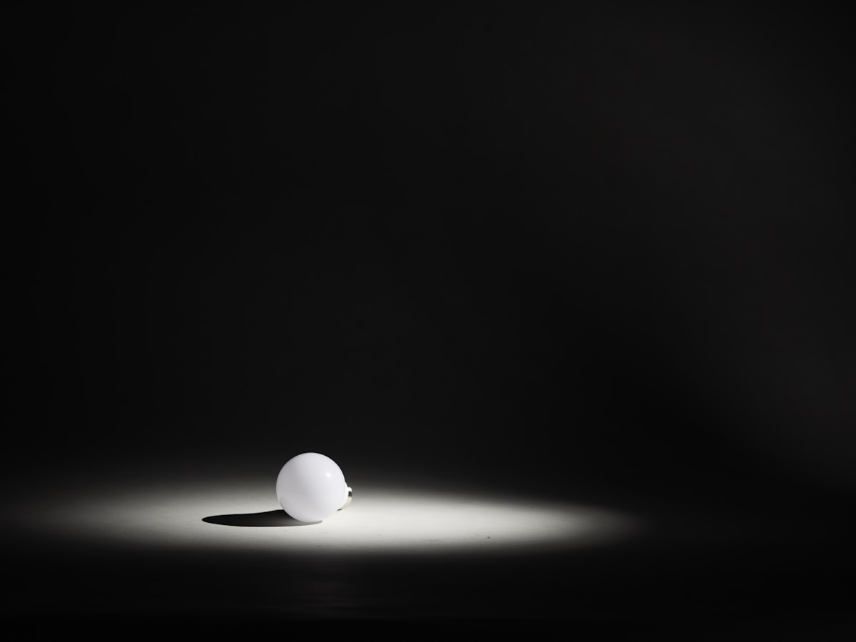 White sphere illuminated by spotlight