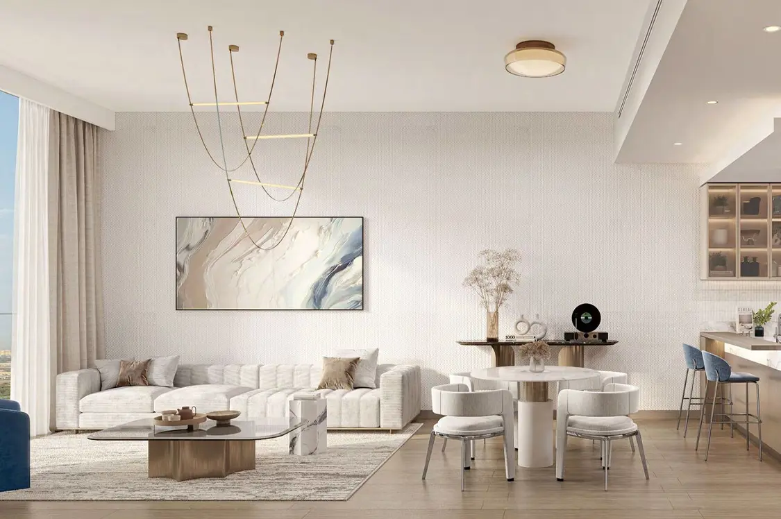 Contemporary living room with a stylish couch, coffee table, and a television, showcasing modern decor.