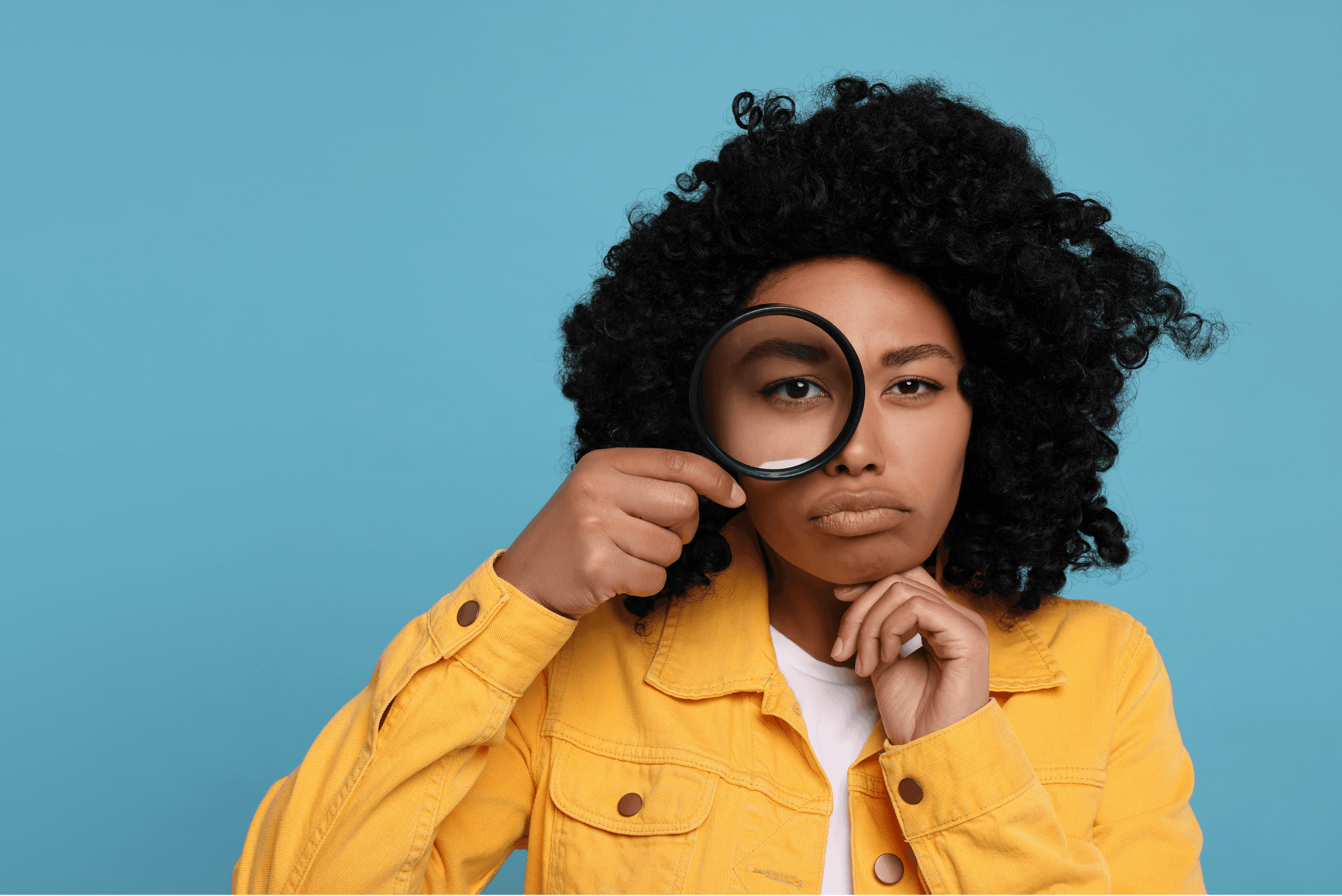 A curious woman with a magnifying glass, ready to investigate.