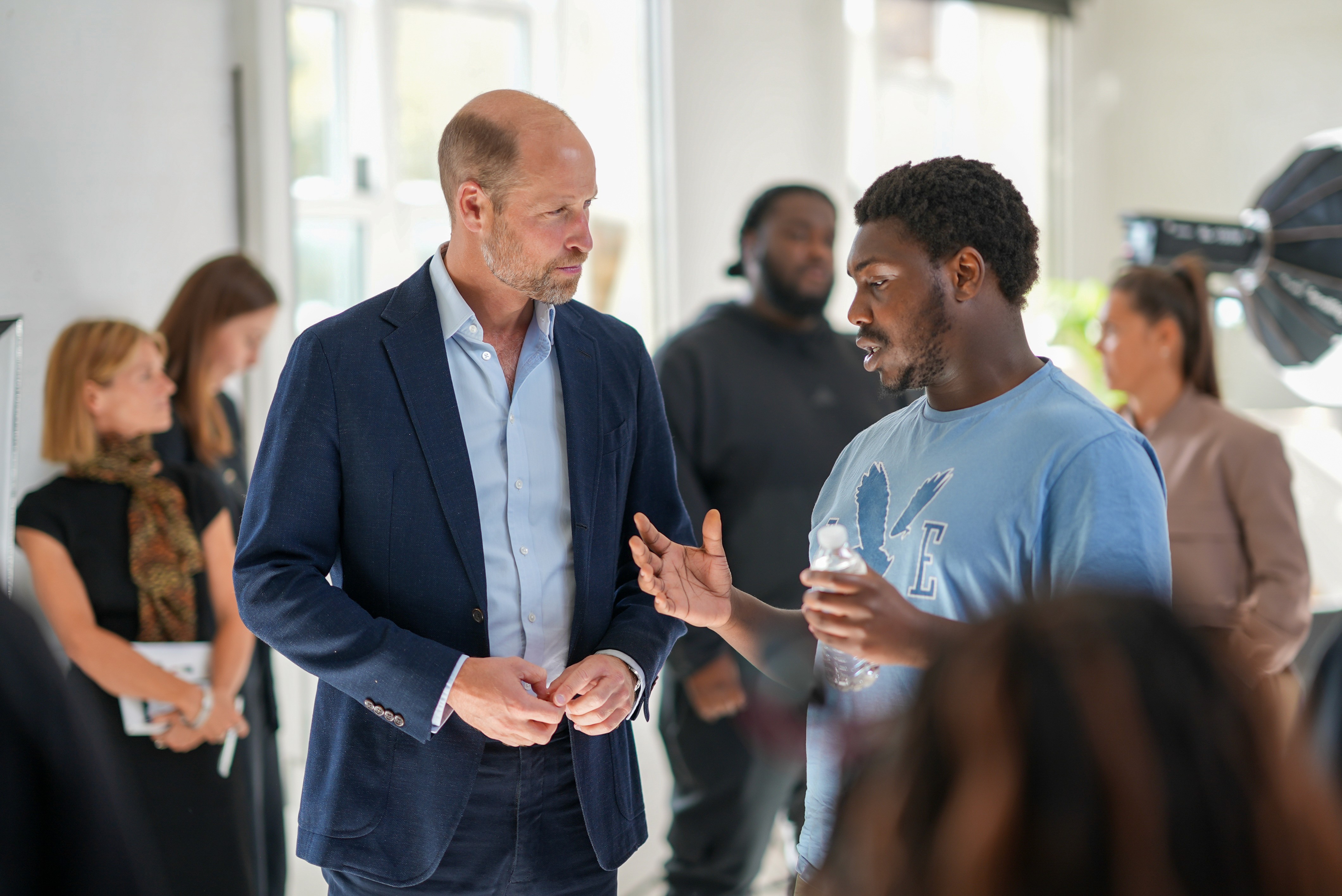 Prime Minister Boris Johnson shakes hands with attendees at a veterans event at Number 10 Downing Street