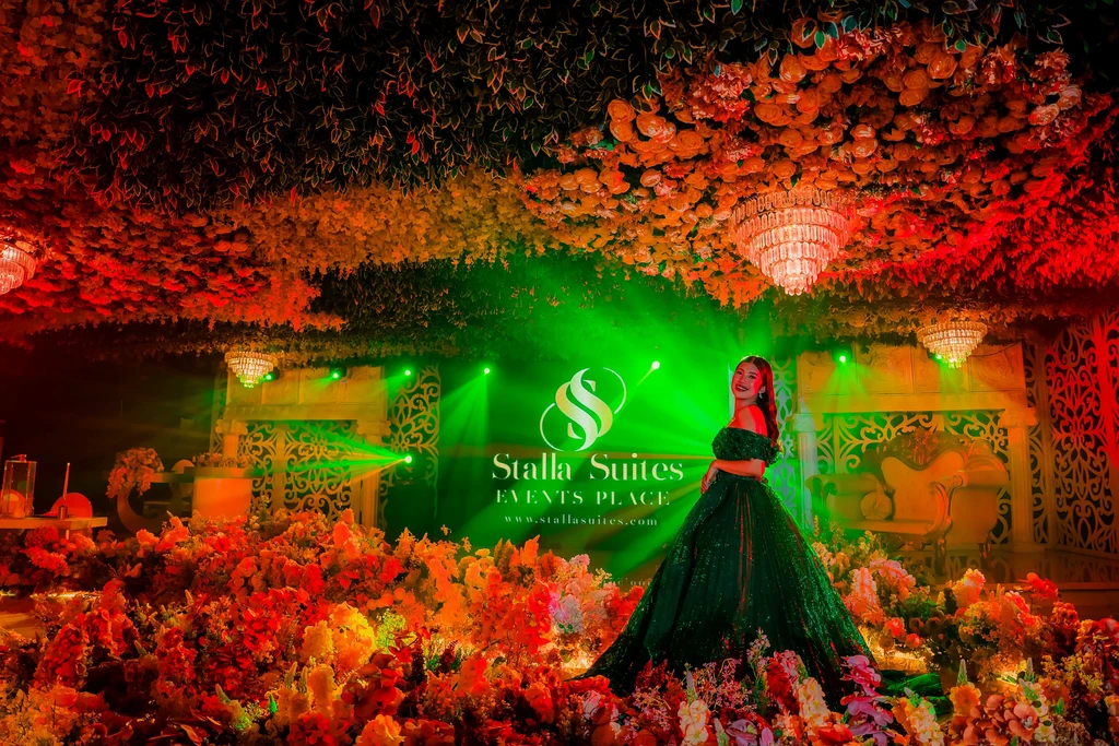 Debutante in green in the red-blossom chamber of Pandora Hall, Quezon City