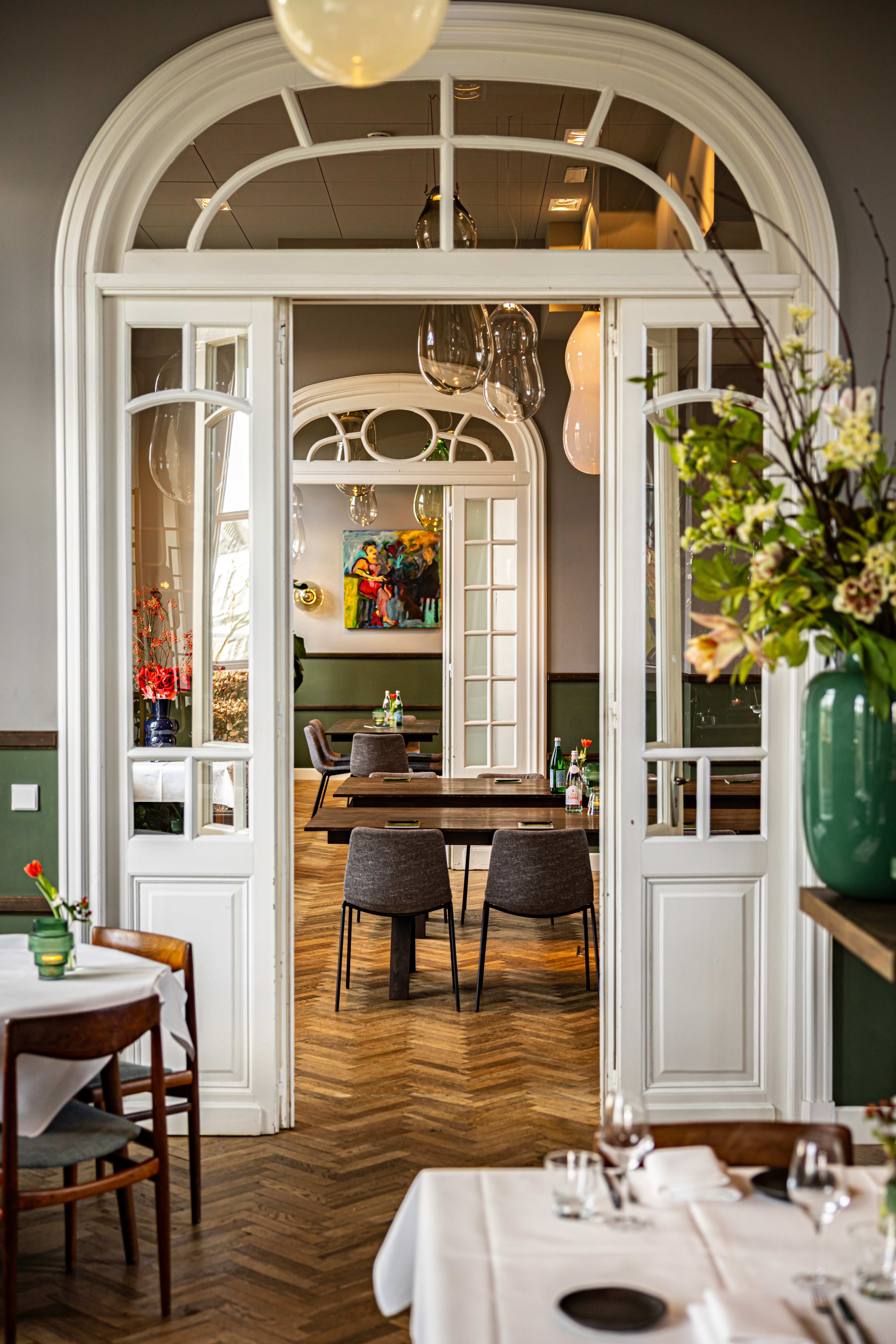 classy afternoon tea setup with macarons, roses and tea