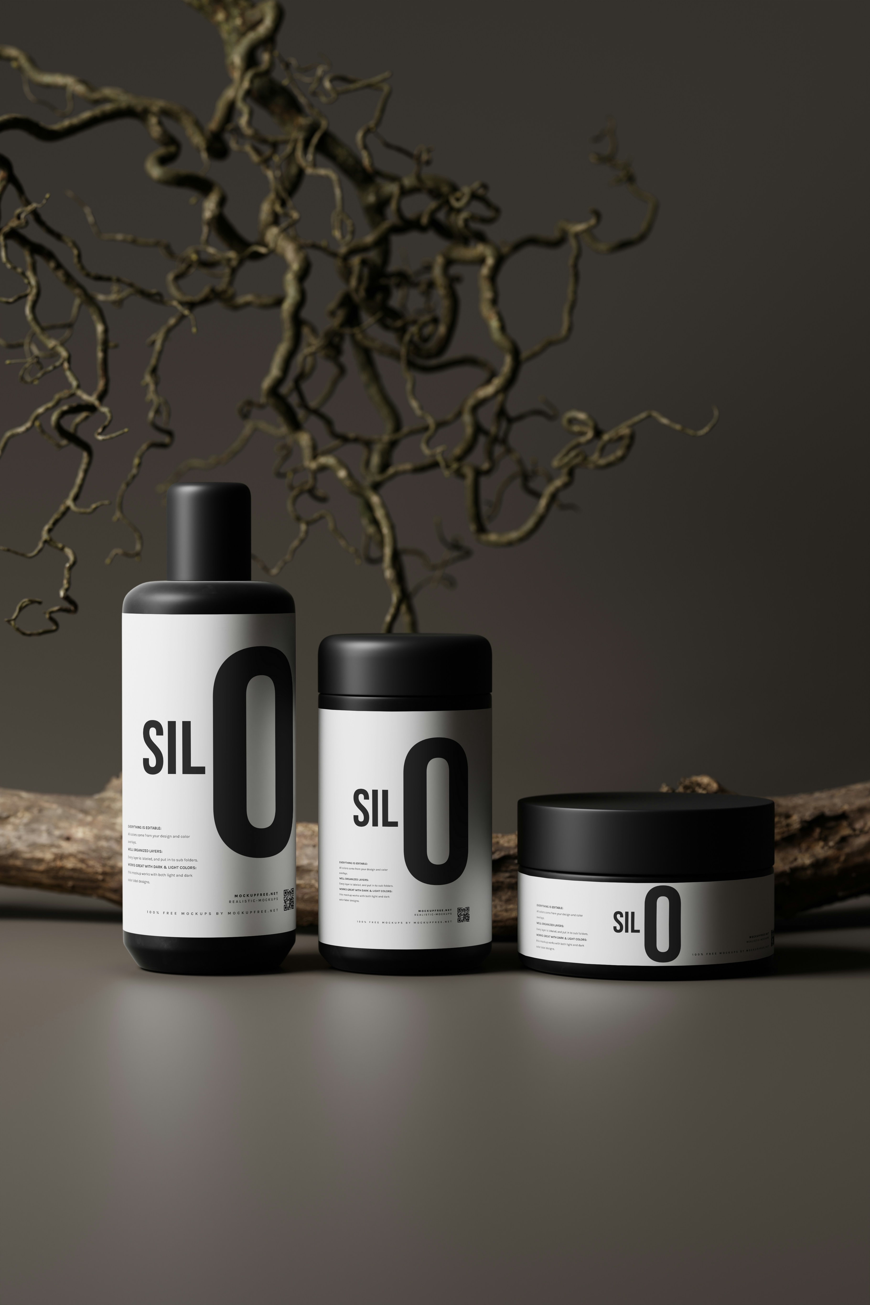 three bottles of sil o sit next to a branch