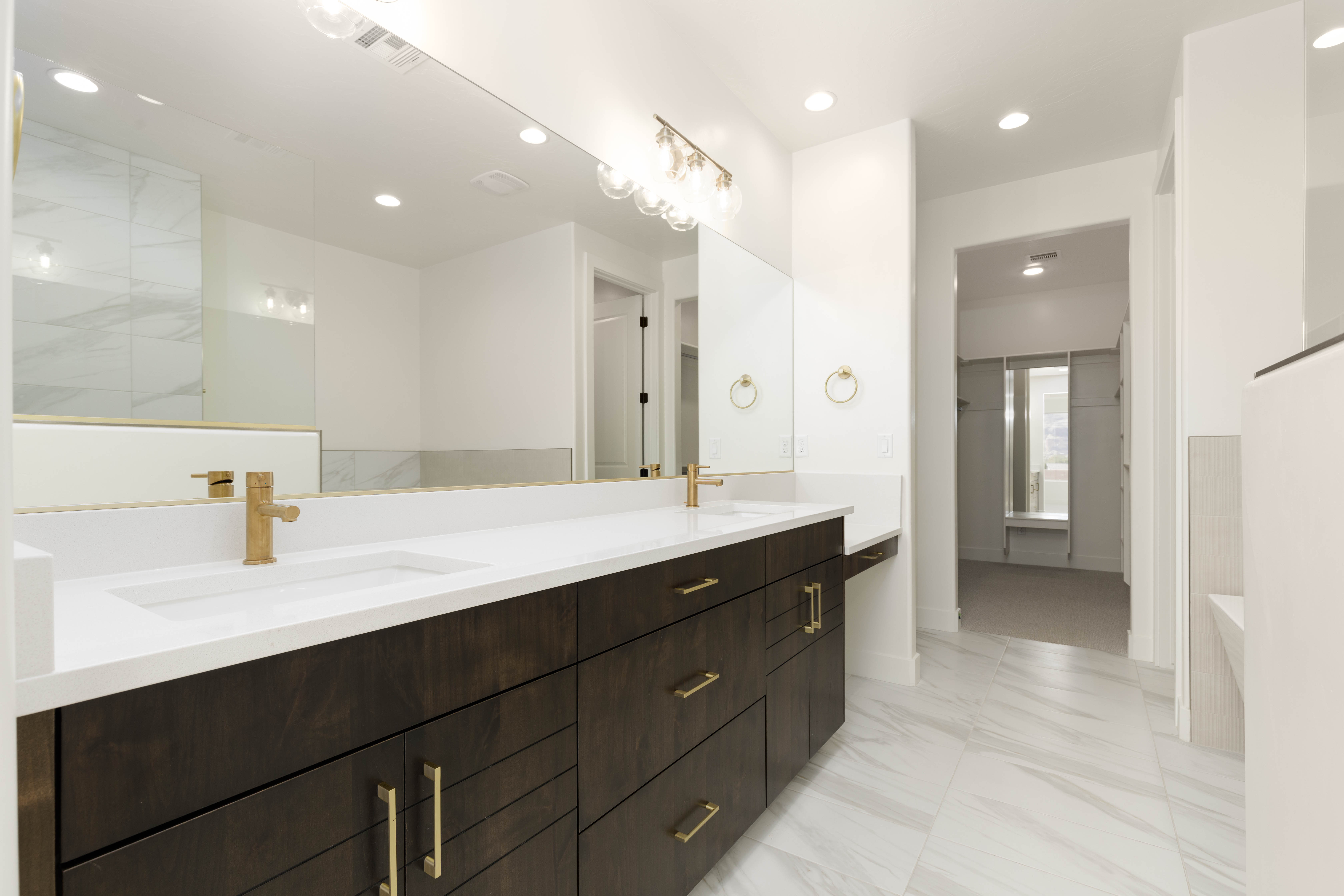Modern primary bathroom vanity with dual sinks and clean finishes in The Meridian home in Hurricane Utah.