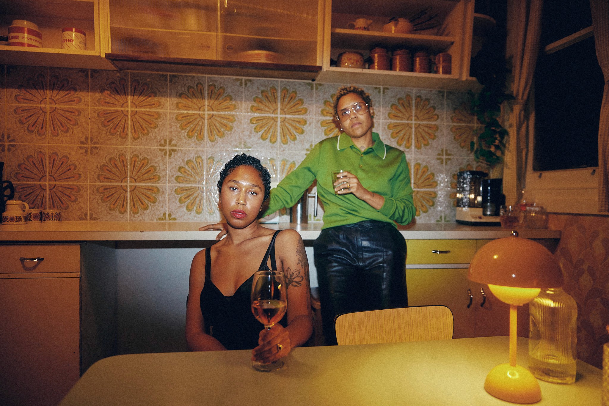 Athletes resting on a blue running track.