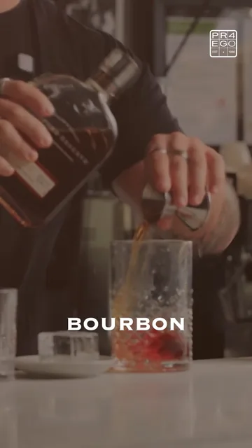 A bartender pours bourbon, under the word “Bourbon”