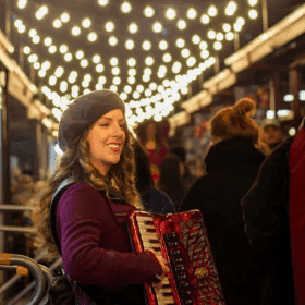 Lucy performing at a Christmas event