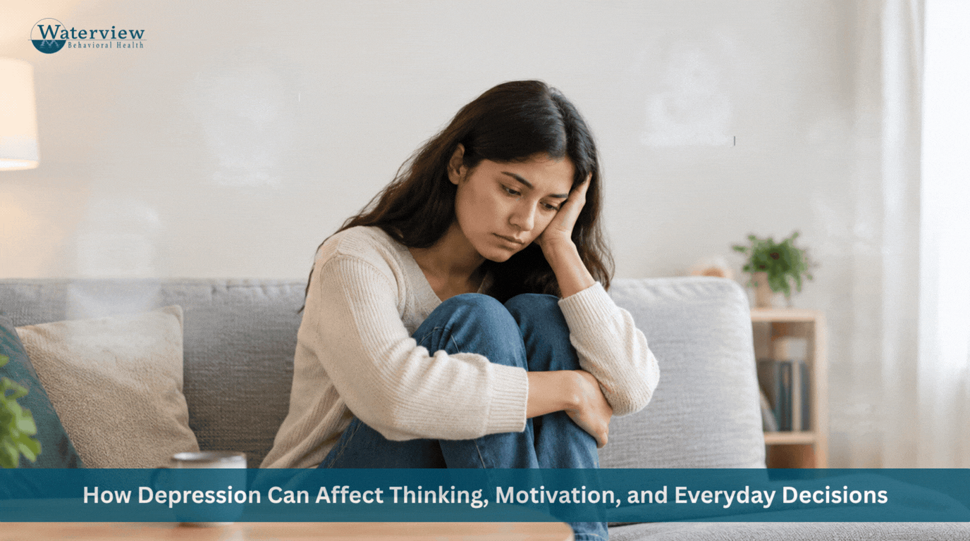 Depressed woman sitting curled on sofa