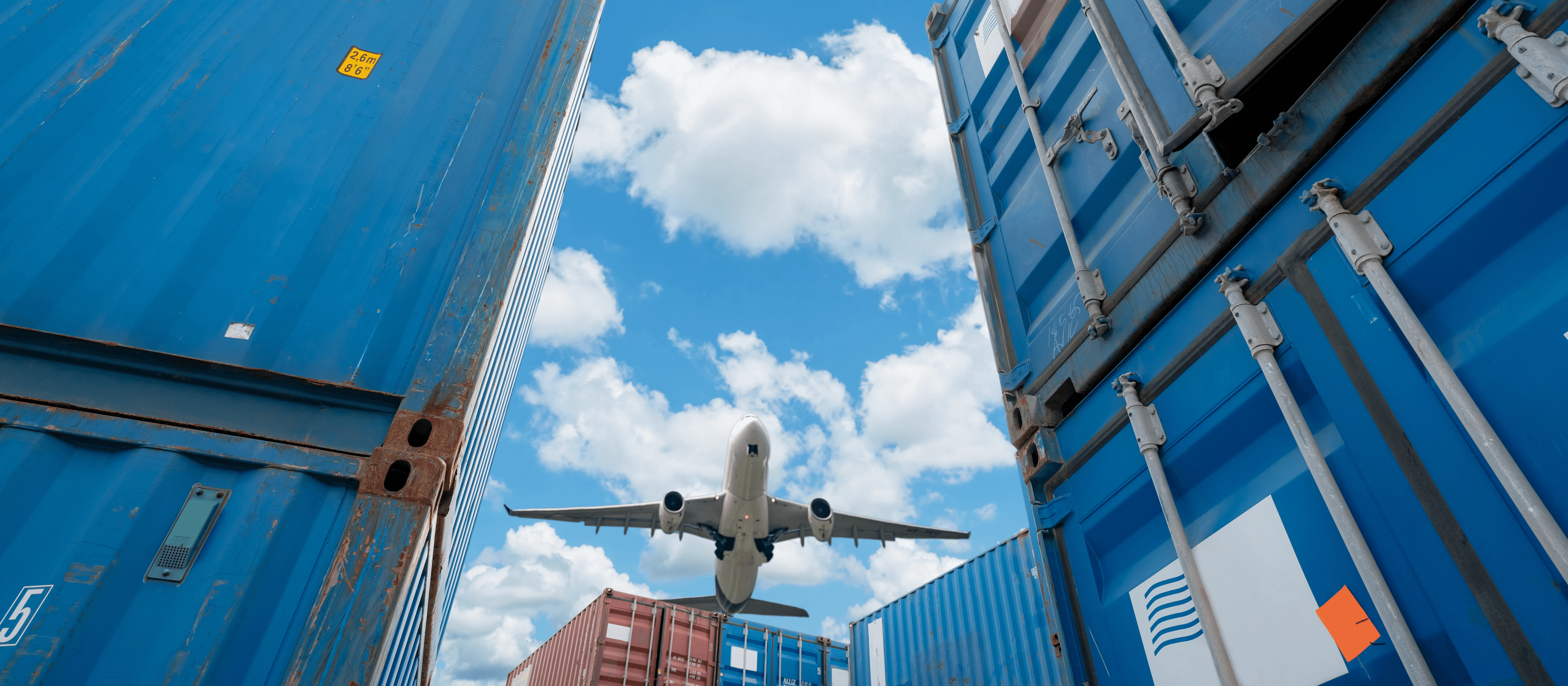 Cargo ships and a plane flying