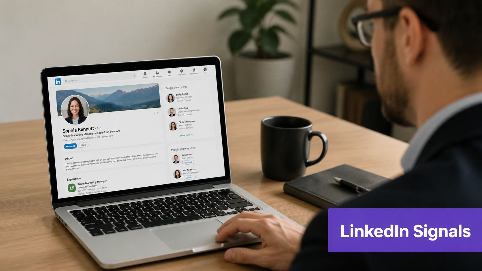 A professional using a laptop to view a LinkedIn profile for b2b sales prospecting and networking.
