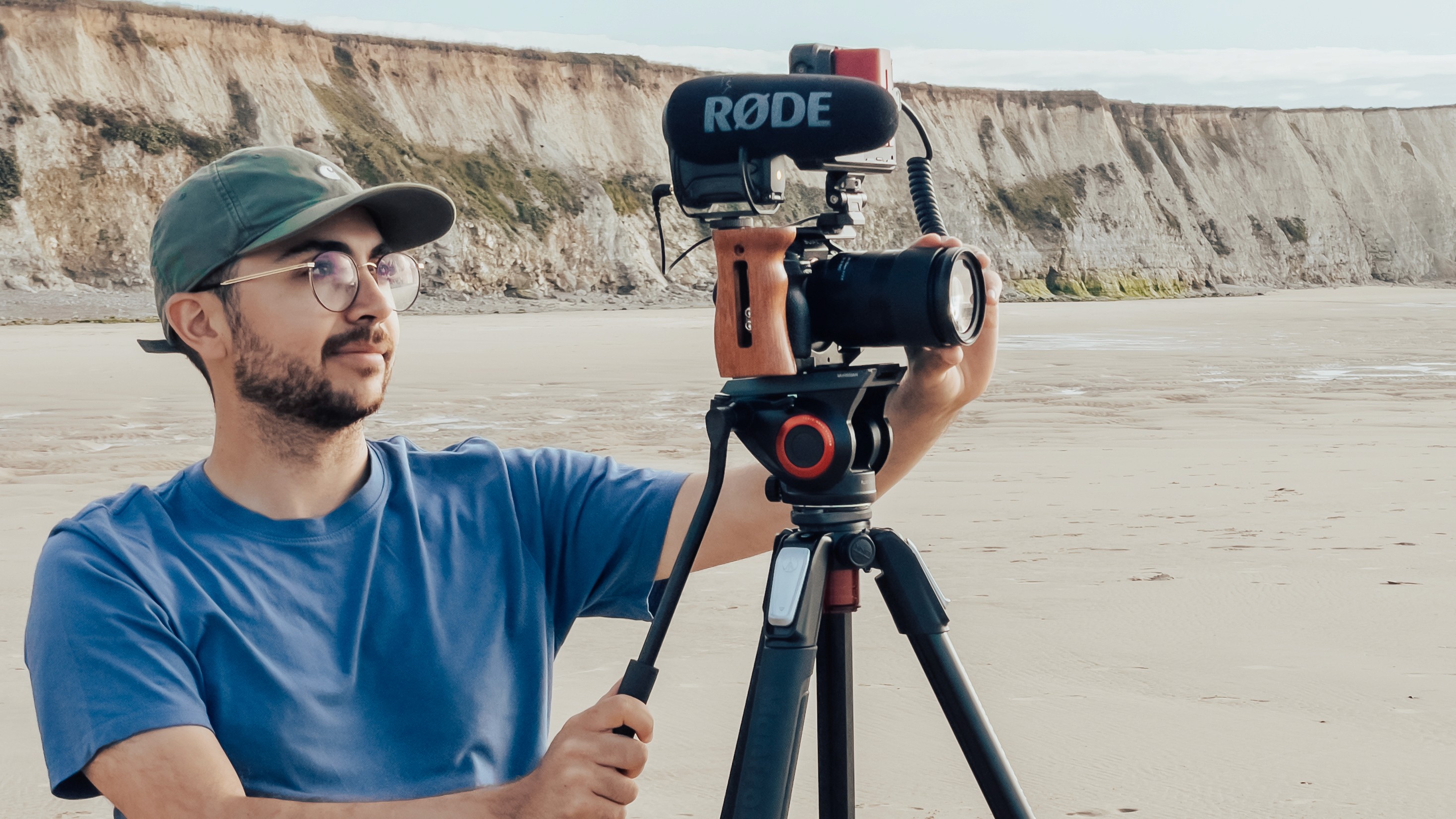 A team of professionals collaborates around a table, discussing documents in a focused and dynamic setting.