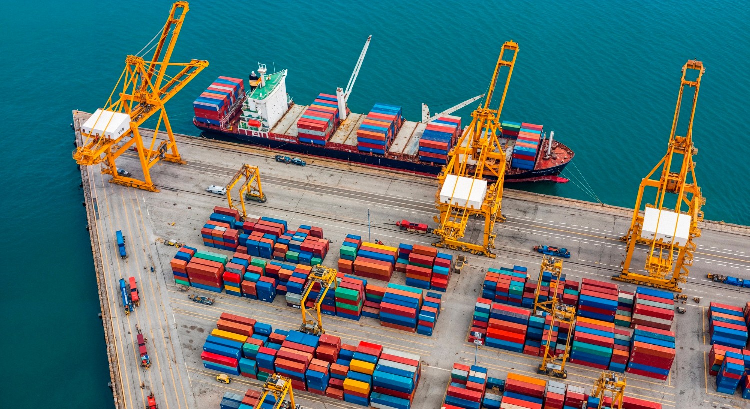 side-view-of-container-vessel-with-cranes-in-background