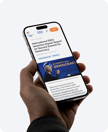 Person holding a smartphone with a camera lens