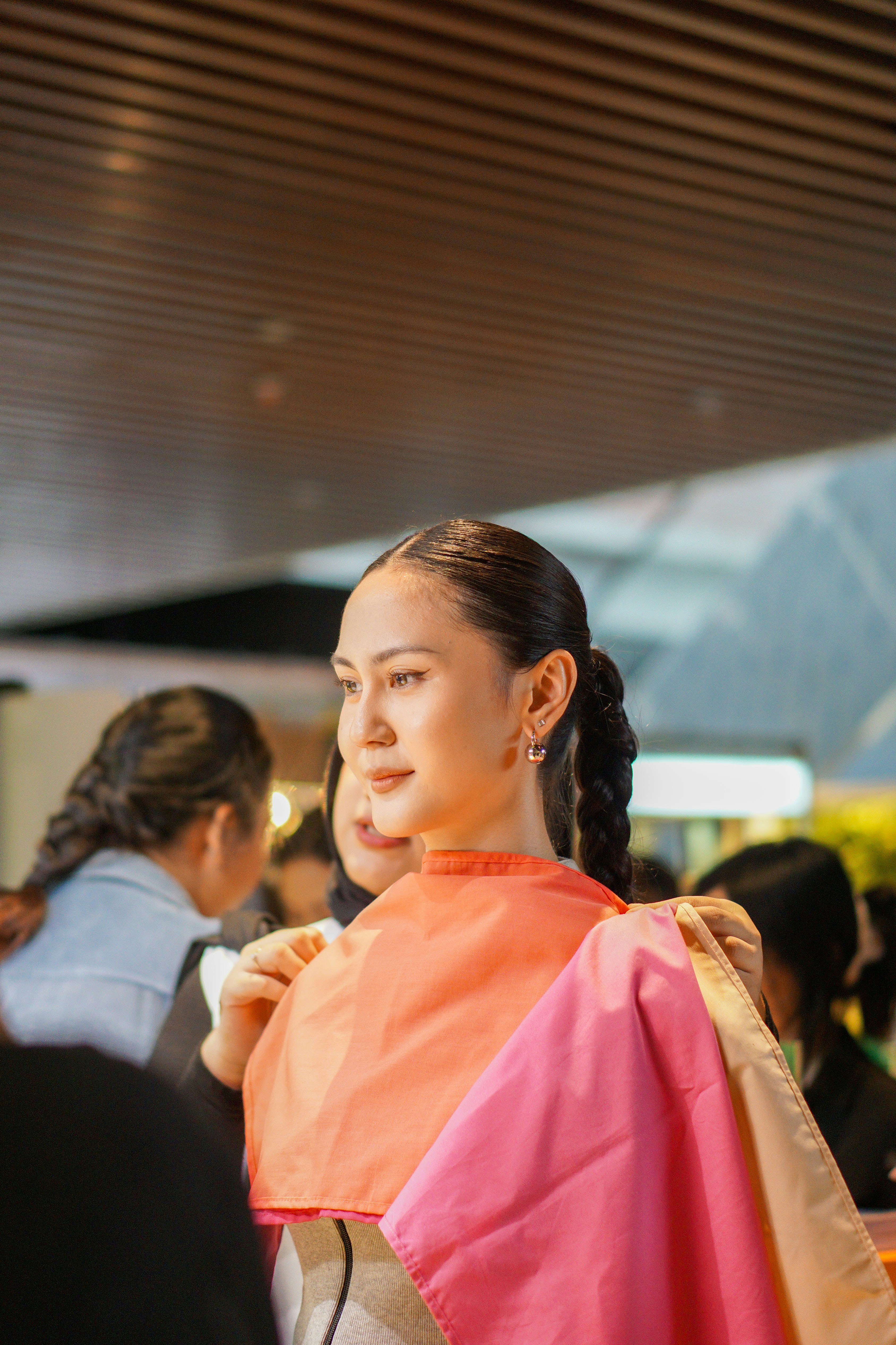 A woman in a pink and orange sari