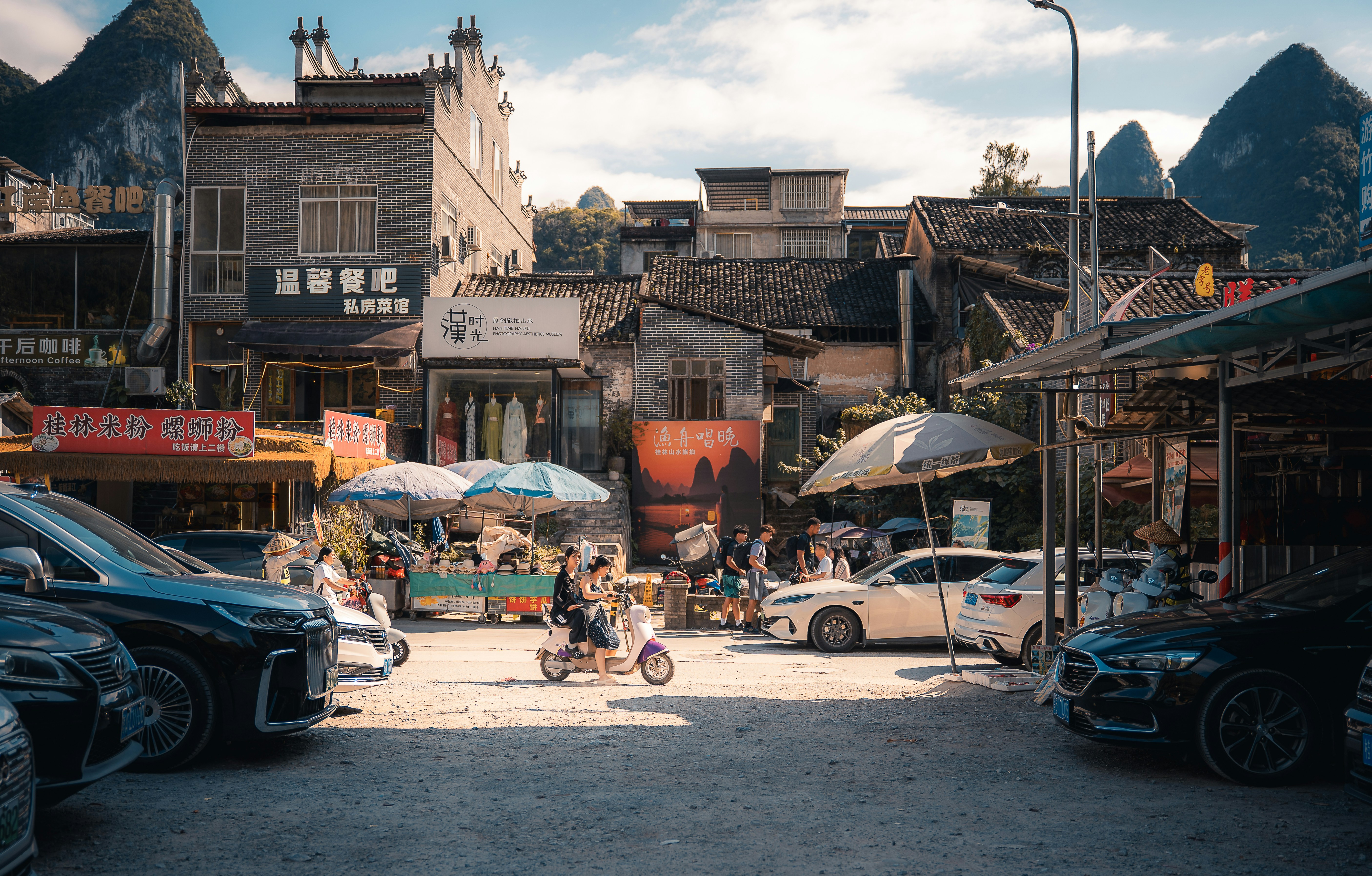 Street scene in a town with mountains in background