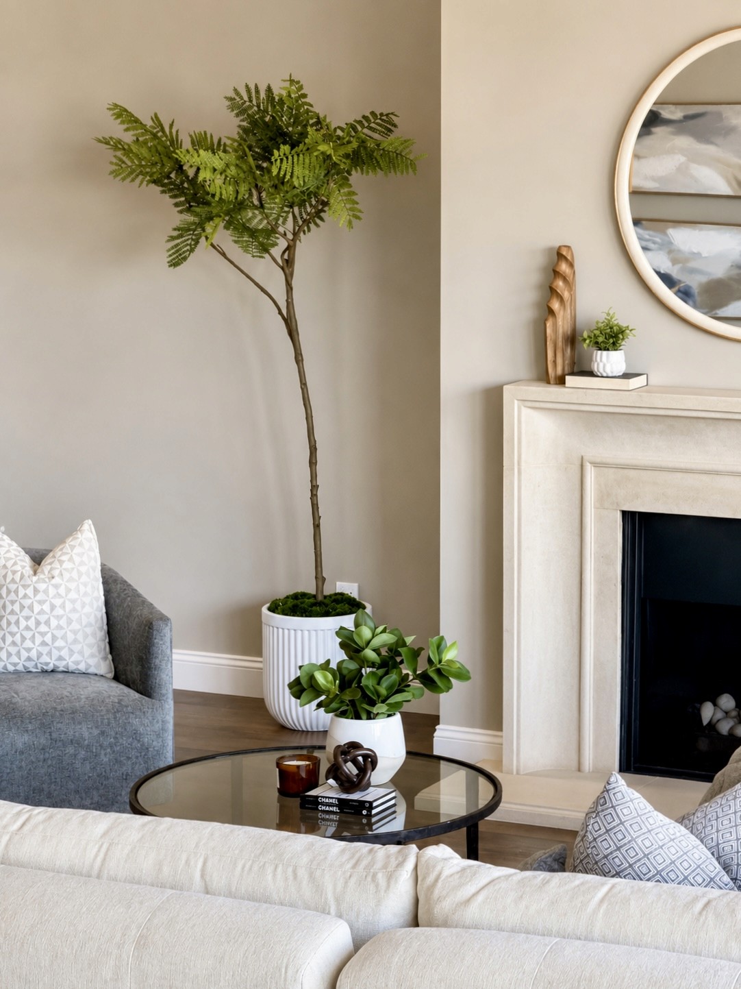 Styled living room corner with a woven armchair and console
