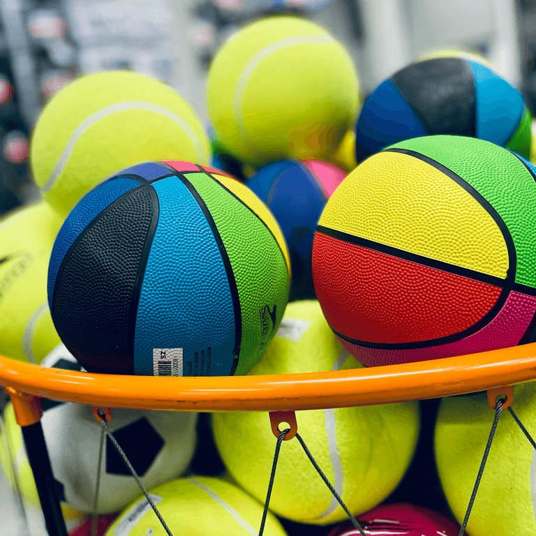 a-basket-full-of-colorful-balls-in-a-store - elizabeth-dunne (unsplash)./pho
