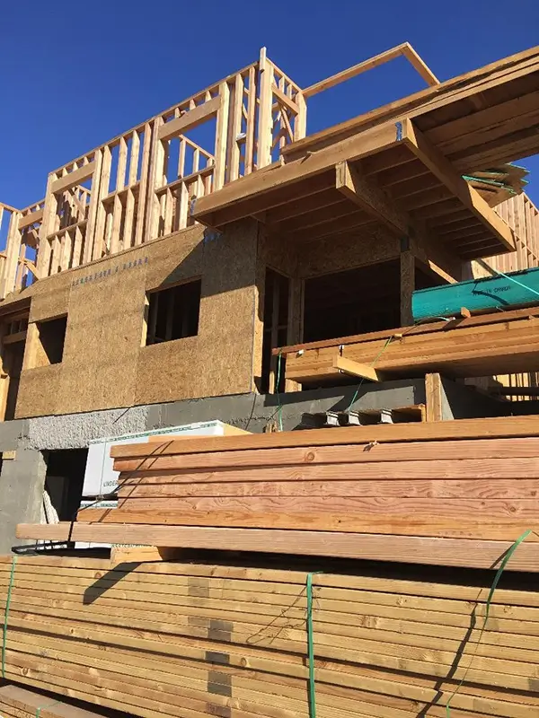 a desk with a computer and speakers on it